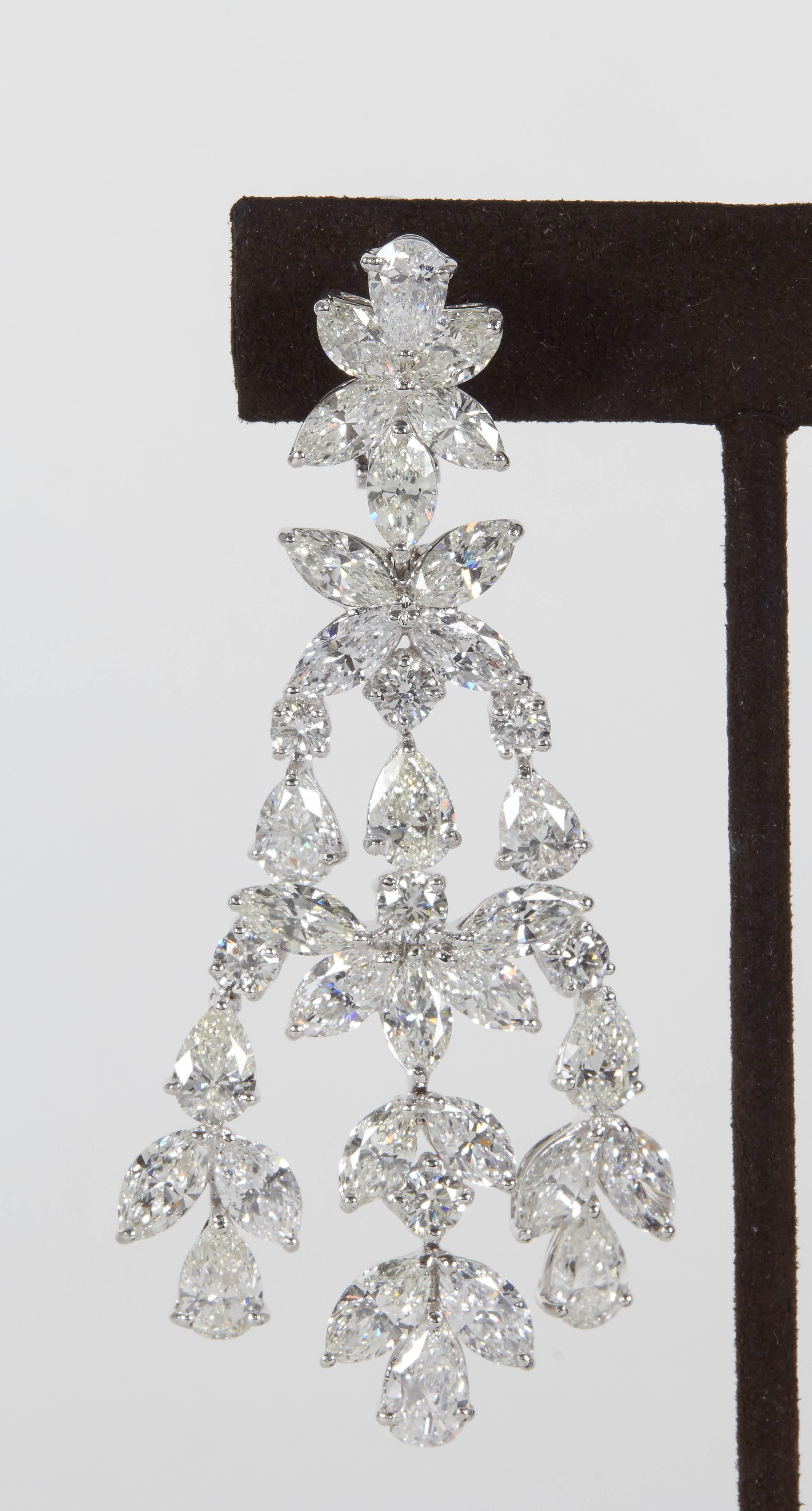 A fabulous statement earring featuring large sized brilliant diamonds. 

46.01 carats of pear, marquise and round brilliant cut diamonds F-G in color VS clarity set in platinum.

A unique and grand design!

Approximately 3 inches in length and