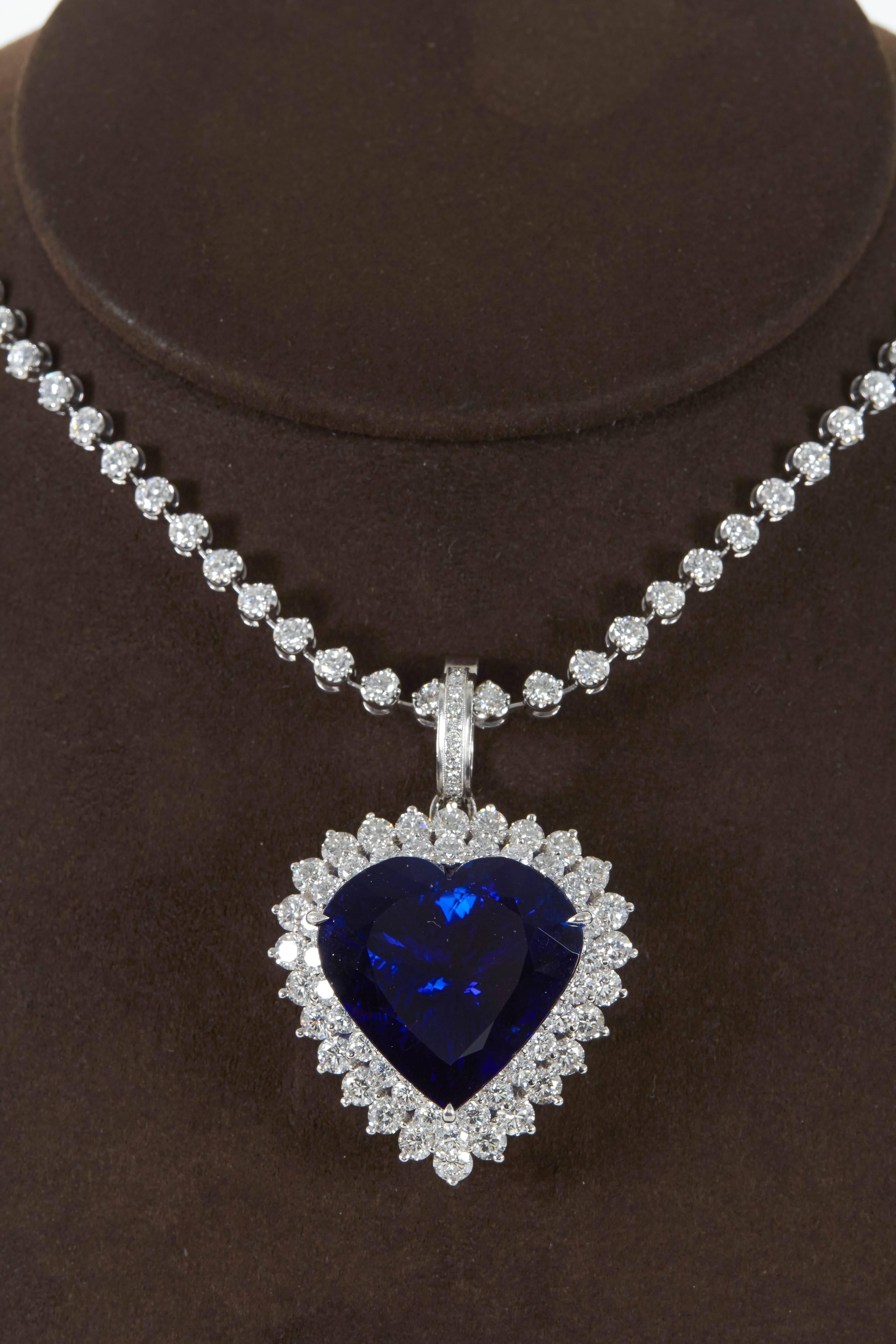 A collectors piece!

49.27 brilliant heart shaped Tanzanite, full of life with blue and purple hues. 
9.20 carats of round brilliant cut F/G color VS clarity diamonds surround the heart shaped Tanzanite.

This important pendant hangs from an
