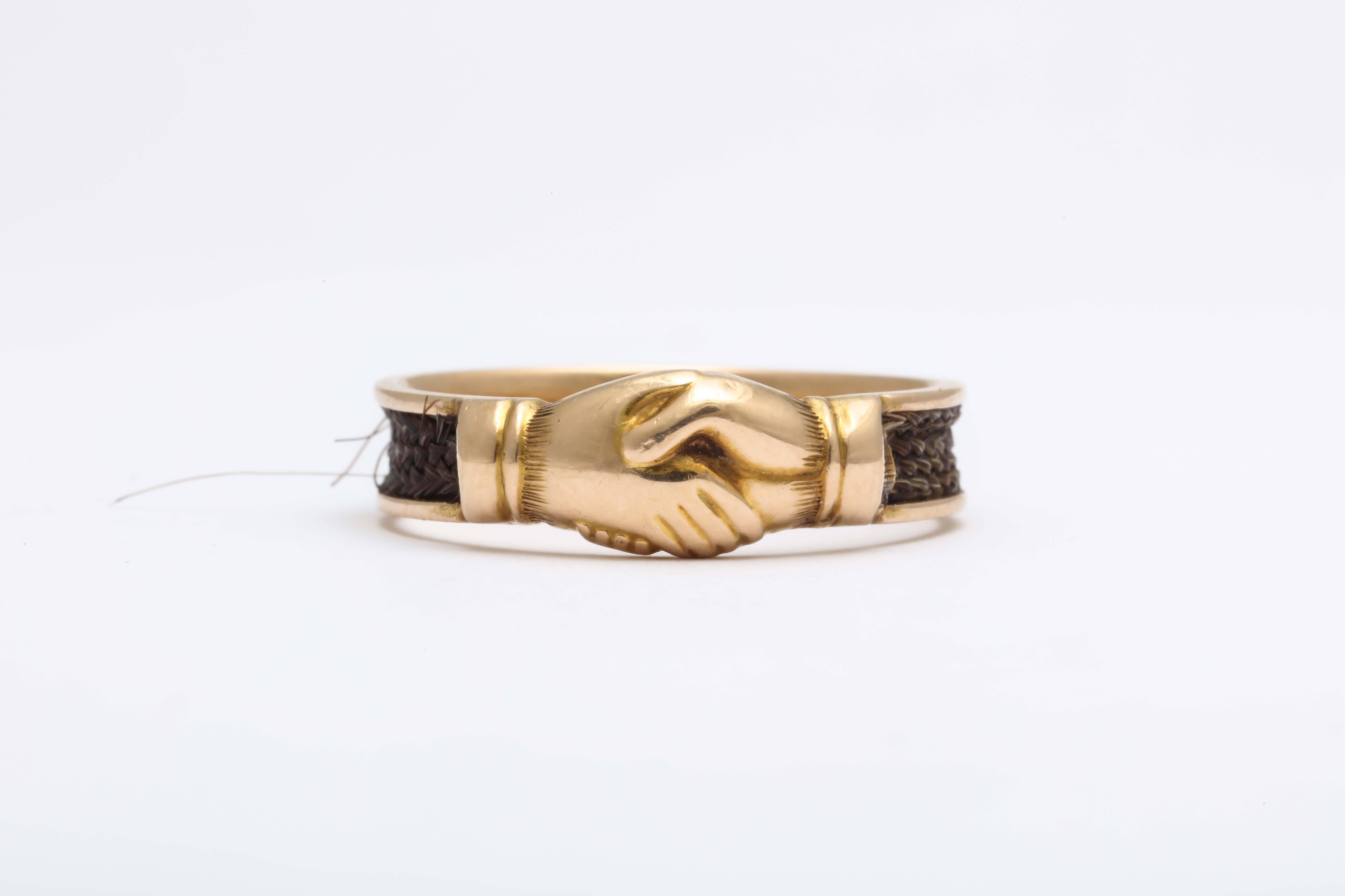 Fede rings- where two hands are clasped-have been popular for centuries. The hands can symbolize both love and friendship. This lovely English one is in 15kt and was a memorial ring for a loved one. Inside it is engraved C. W. died Dec. 10th 1868.