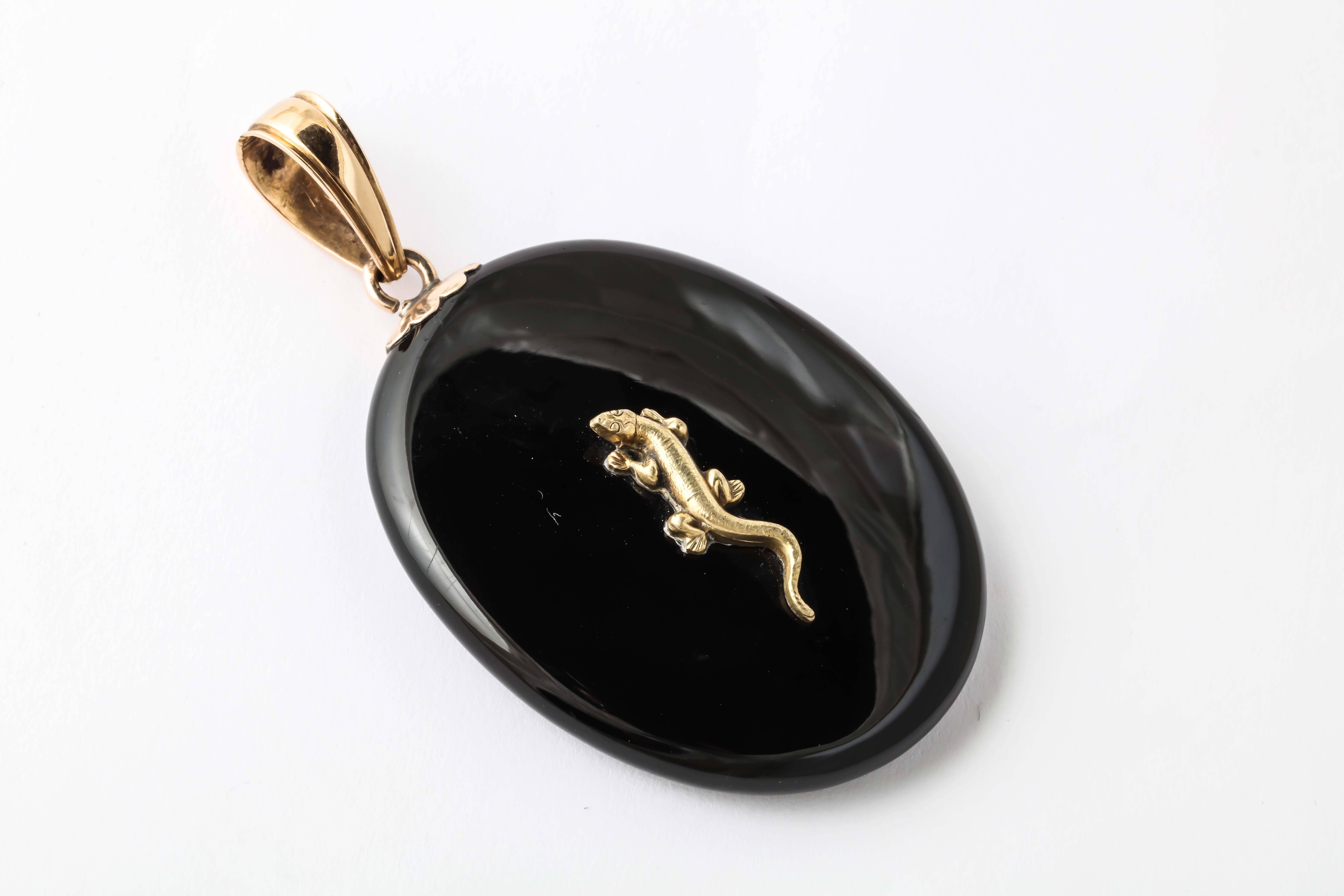 This charming locket is made of Jet and 15K gold. The best Jet was found off the coast in England. It is very tightly compressed wood that has fossilized over millions of years. It is lightweight, durable, and has a high sheen when polished. As