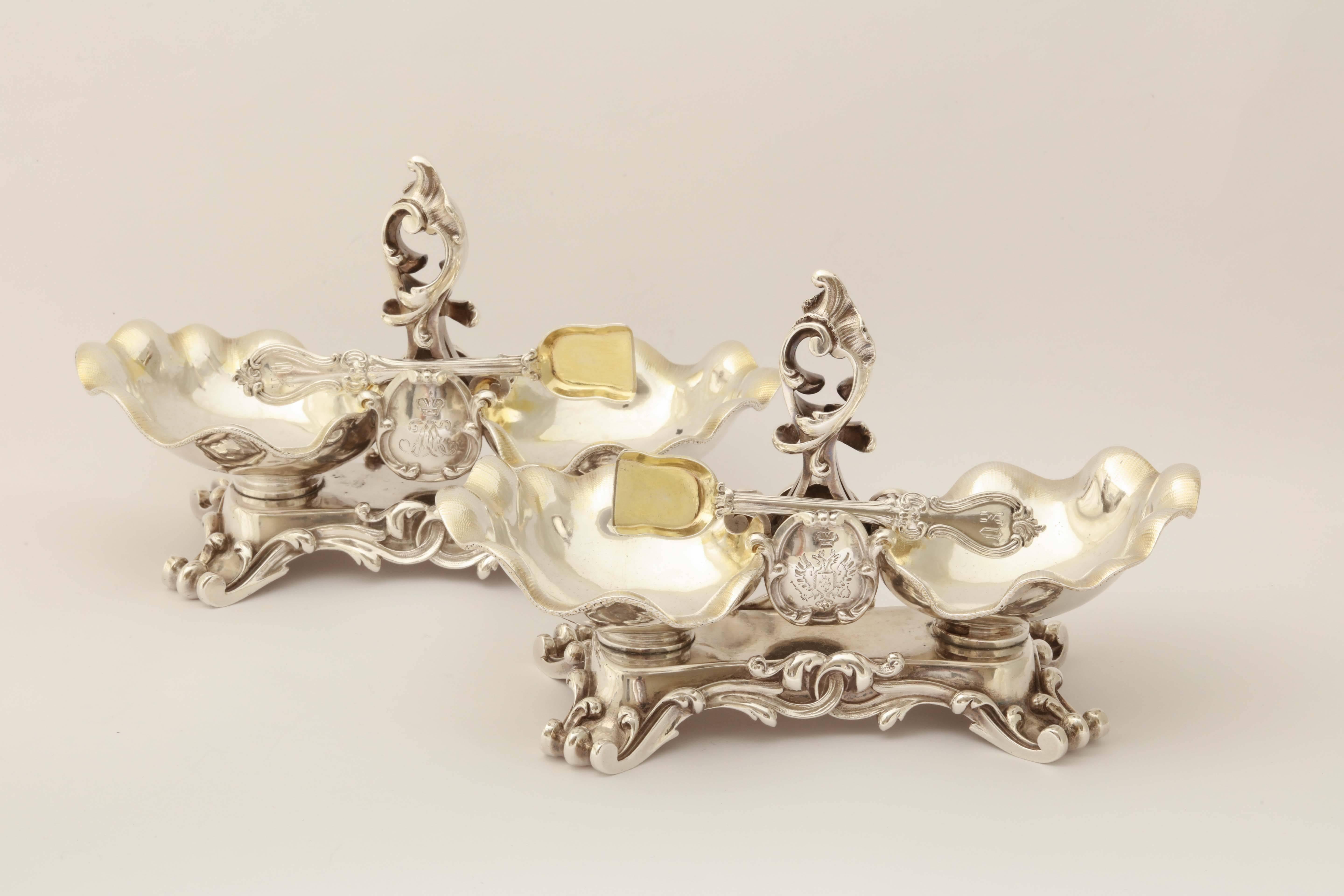 A pair of double salts in the rococo style from the wedding service of Grand Duke Michael Nikolaevich (1832-1909). The bowls are formed as shells flanking a twisted stem supporting a central cartouche engraved MN beneath the Imperial crown. The