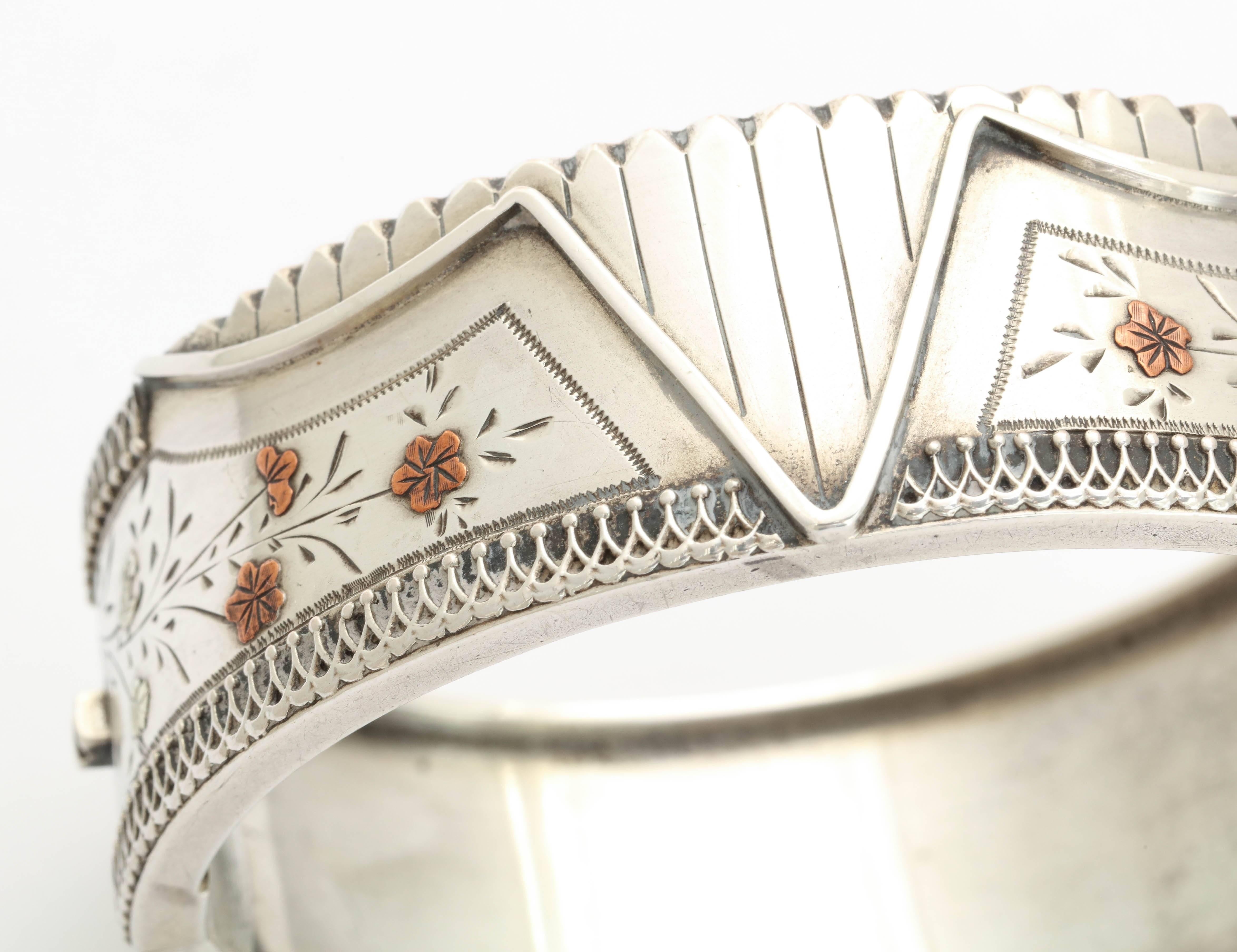 We admire he geometric detail of this Silver Victorian Cuff, and the wonderful engraving of gold washed spring flowers. The designs of Victorian silver are extremely varied. This bracelet hints at the risqué image of a partially undone corset.