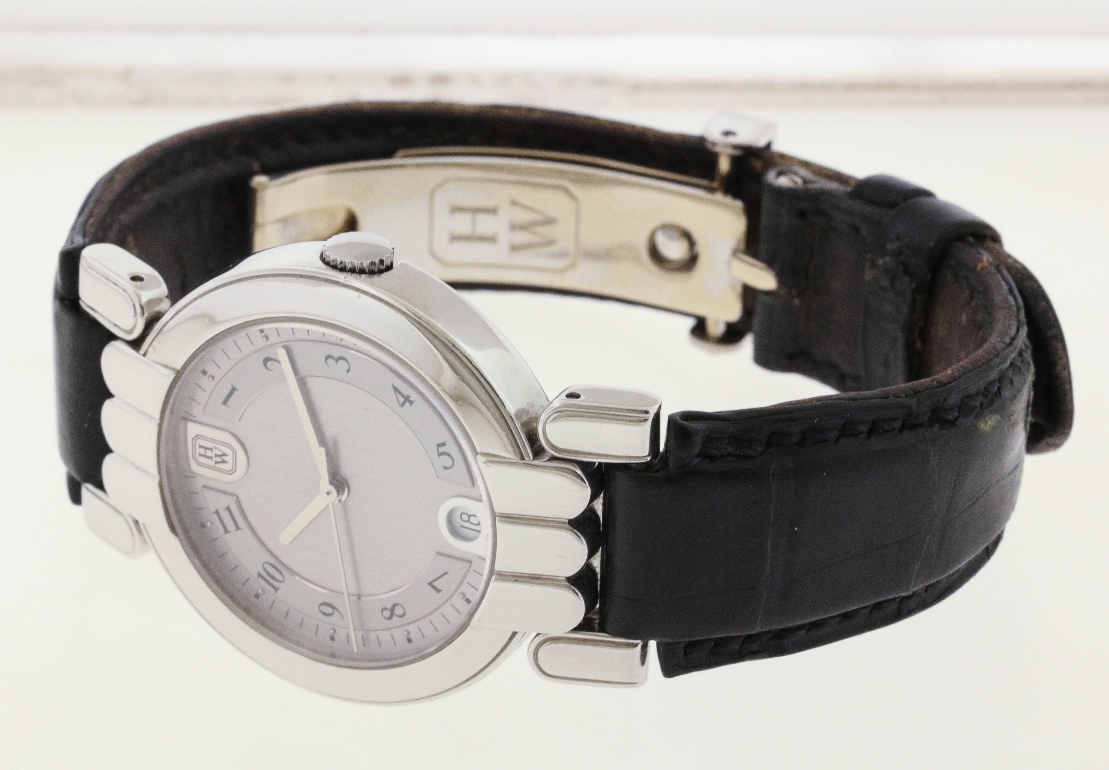Platinum Harry Winston Premier Date wristwatch, circa 2010, is a center seconds, self-winding wristwatch with 18K white gold deployant clasp.  The 37mm case has a see-through back, signature case stylized case with extended hinged lugs and