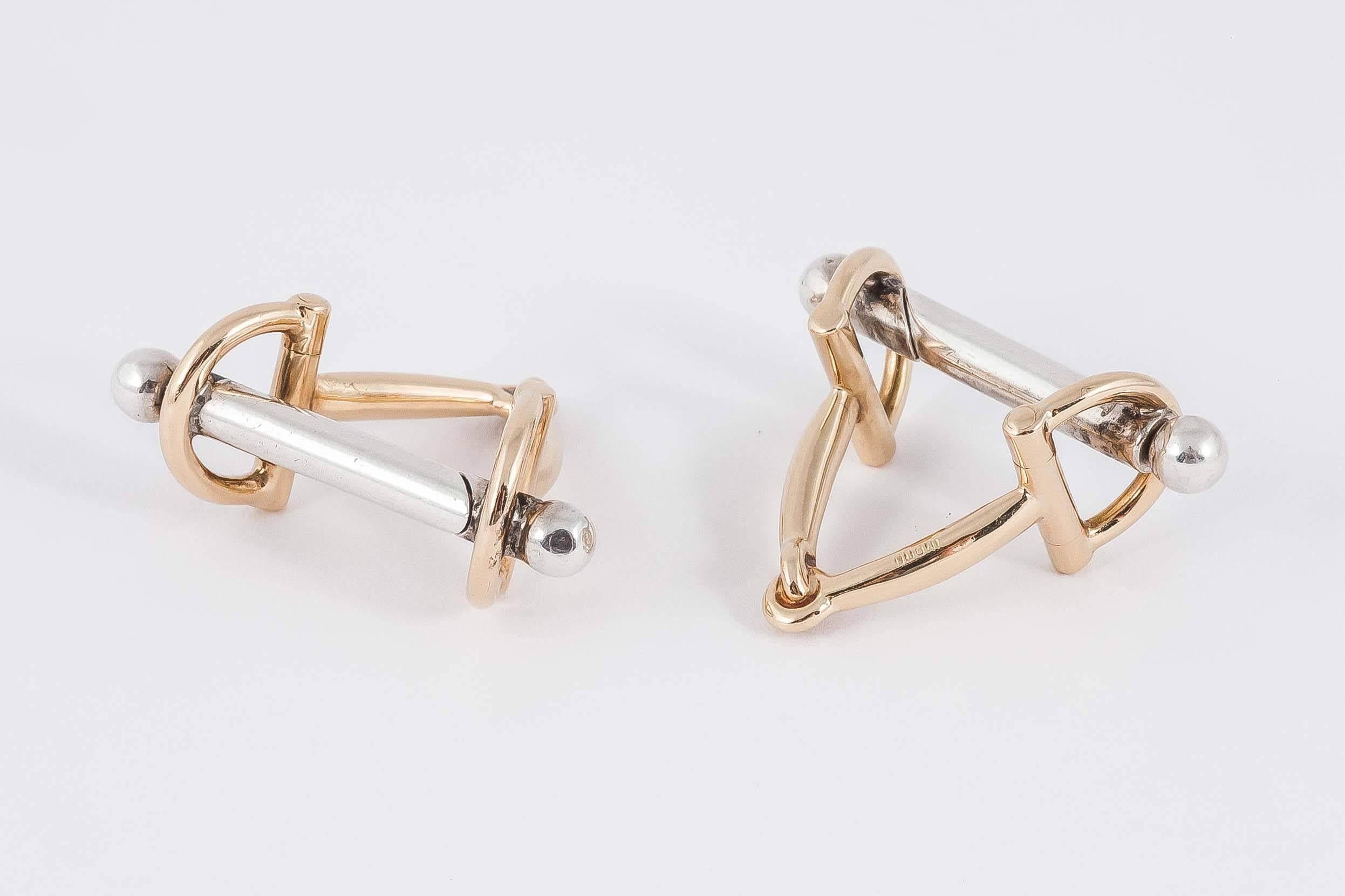 Pair of riding stirrup cufflinks in 750 stamped yellow gold [18kt], the bar in white gold.Signed Gucci, c,1975. solid heavy weight