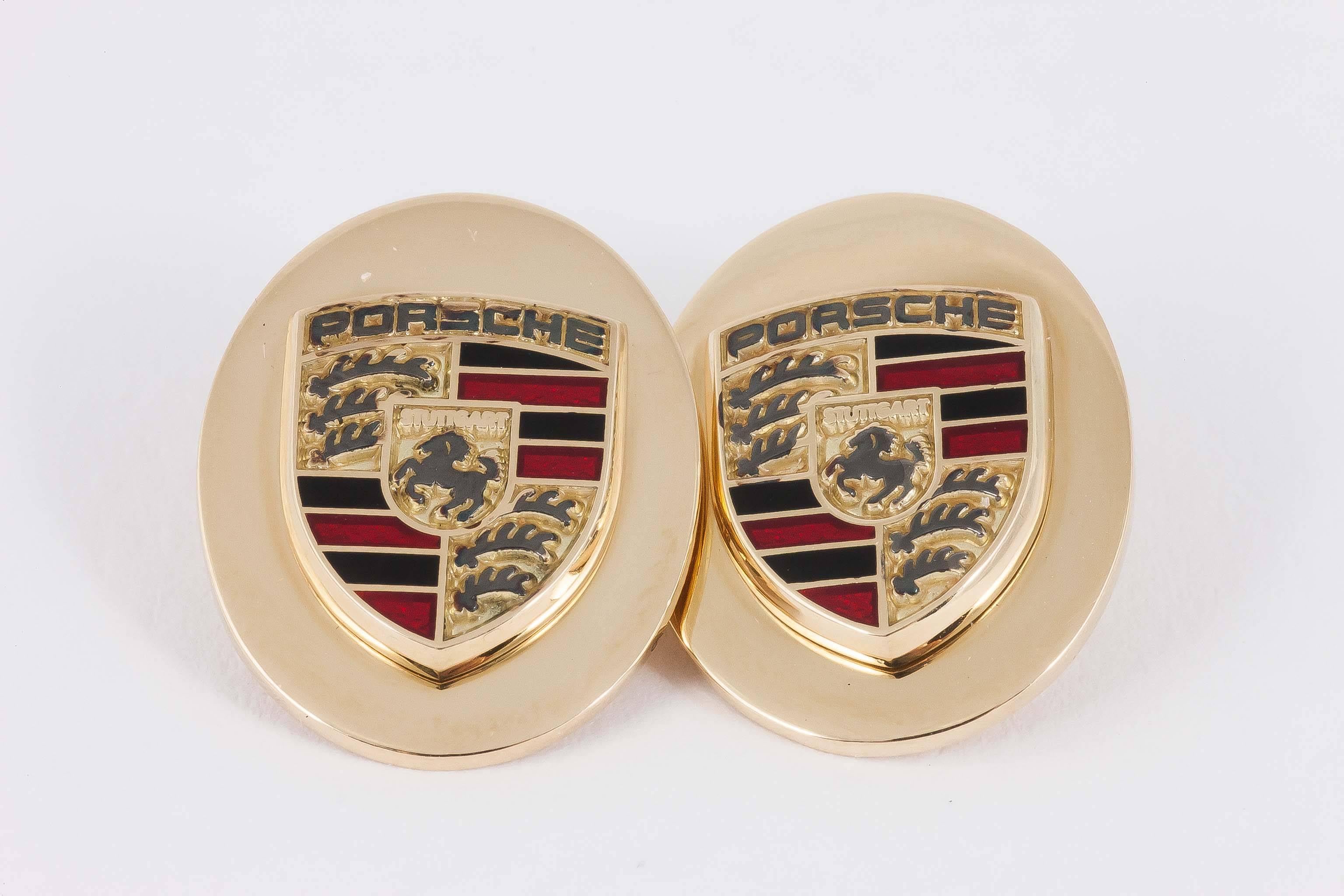 A heavy pair of fine quality oval double sided cufflinks in 18 carat yellow gold with the emblem of the Porsche motor car en relief in black and red enamel. Designed exclusively for Nigel Norman Fine Jewels of Grays Antiques Centre London by a