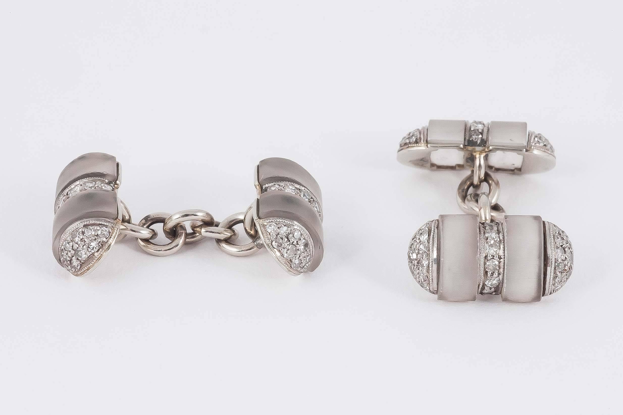 Pair double sided cufflinks and 2 studs set with frosted crystal and diamonds,barrel shaped,mounted in 18ct white gold.c,1920