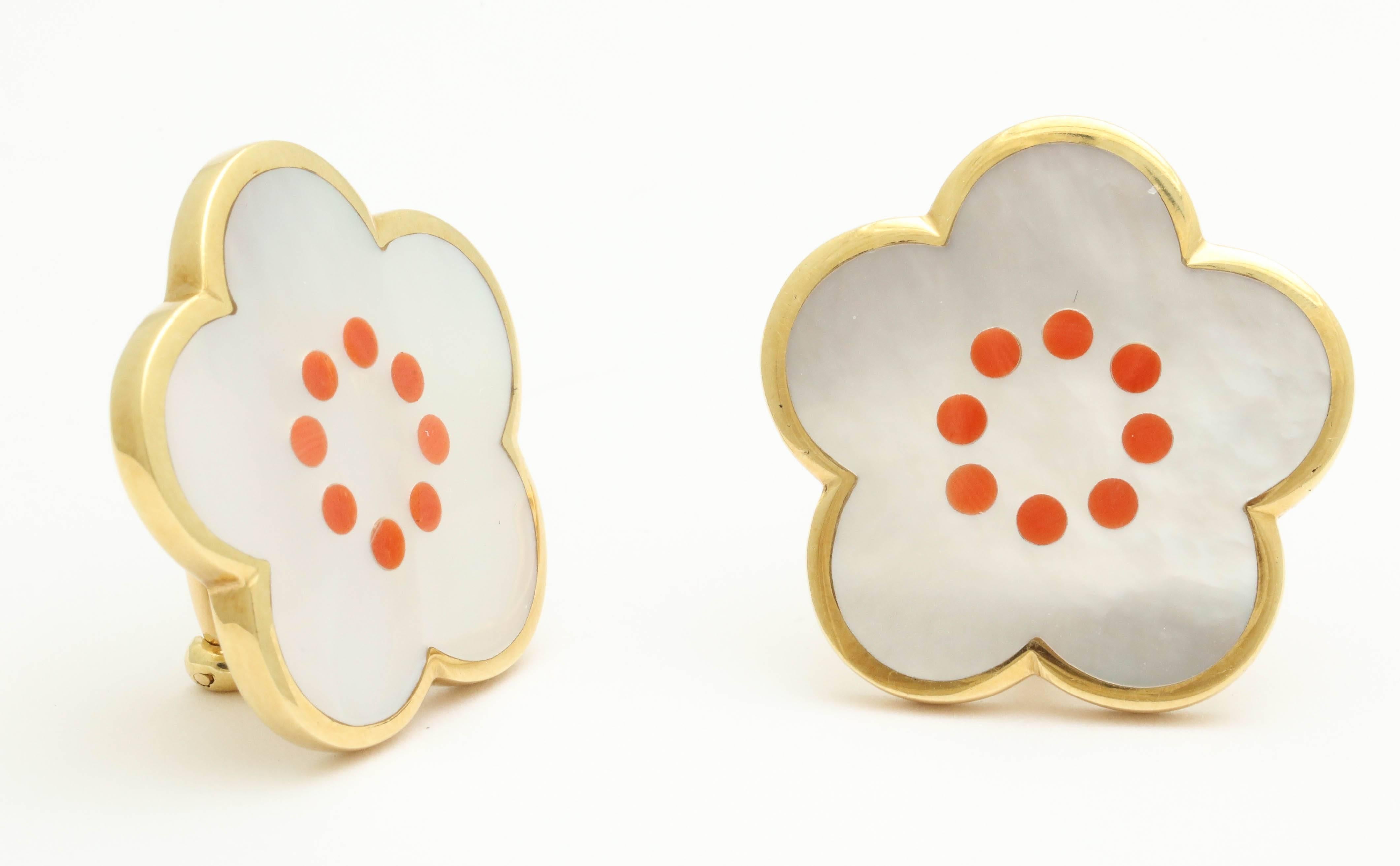 18kt Yellow Gold Flower Earclips Designed With 2  Floral Cut Inlaid Mother Of Pearl Stones And 16 Circular Cut Inlaid Coral Stones. Clip-On Backs NOTE: Posts May Be Added For Pierced Ears. Created By Tiffany & Co. In the 1980's.