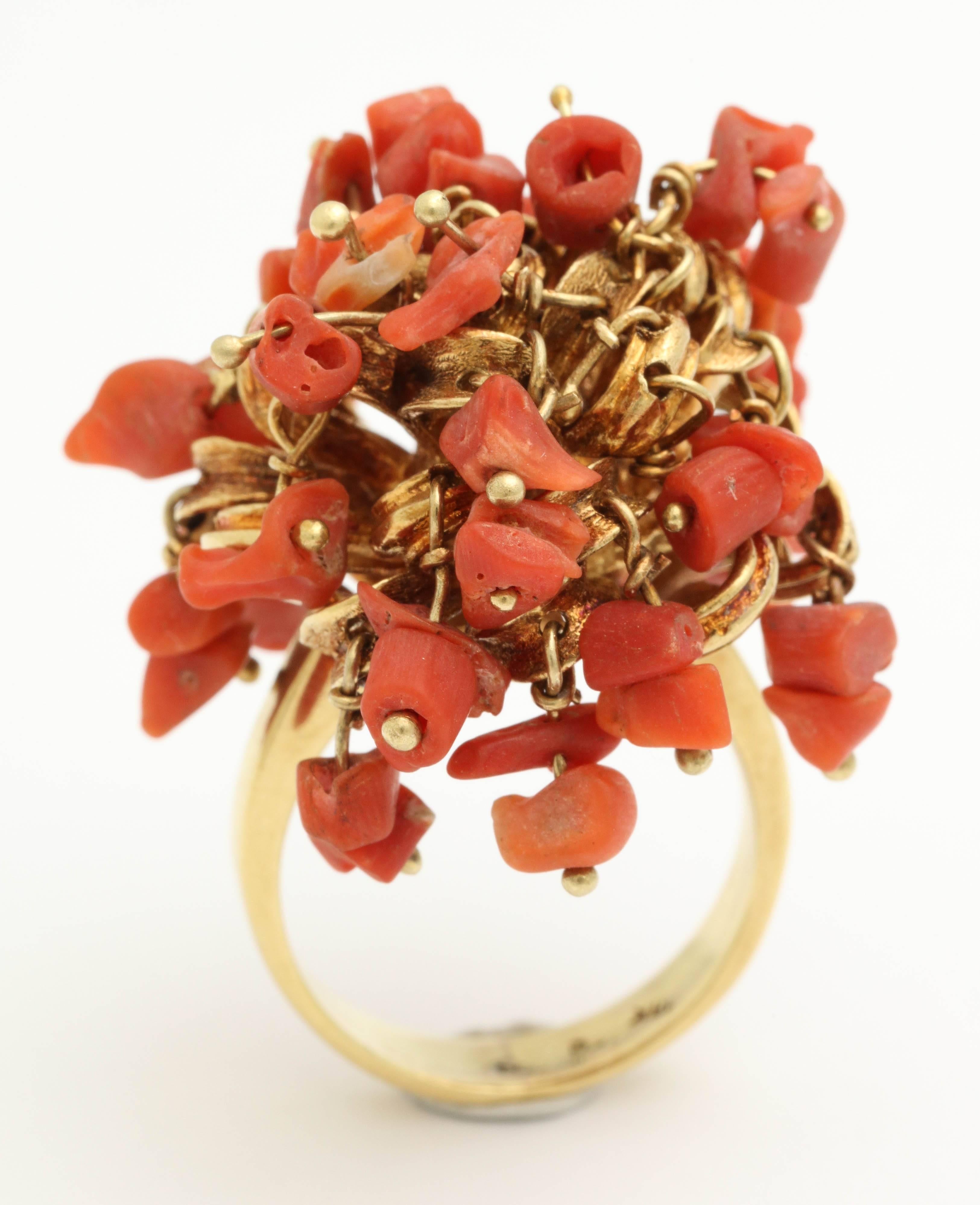 18kt Yellow Gold Shaky Coral Ring Consisting Of Multiple Moveable Tremblant Coral Pieces Attached By 18kt Yellow Gold Pelvits. Made In Italy In the 1960's.