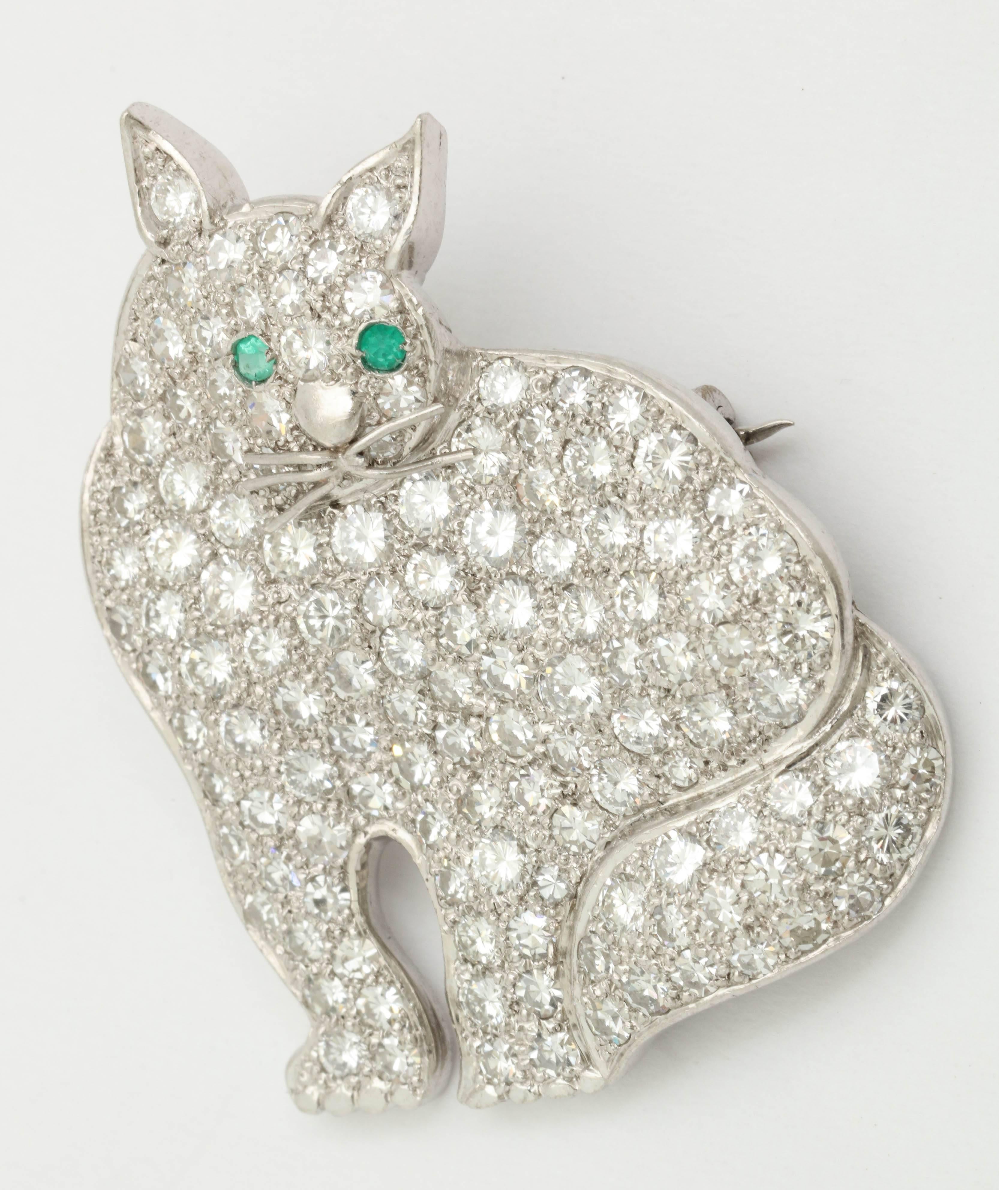 One Super Kitty Cat Brooch Embellished With Numerous High Quality Antique Cut Diamonds Weighing Approximately 6 carats Total Weight. Further Decorated With 2 Faceted Emeralds For Eyes.Further designed with Platinum Hand-Made Whiskers & nose.