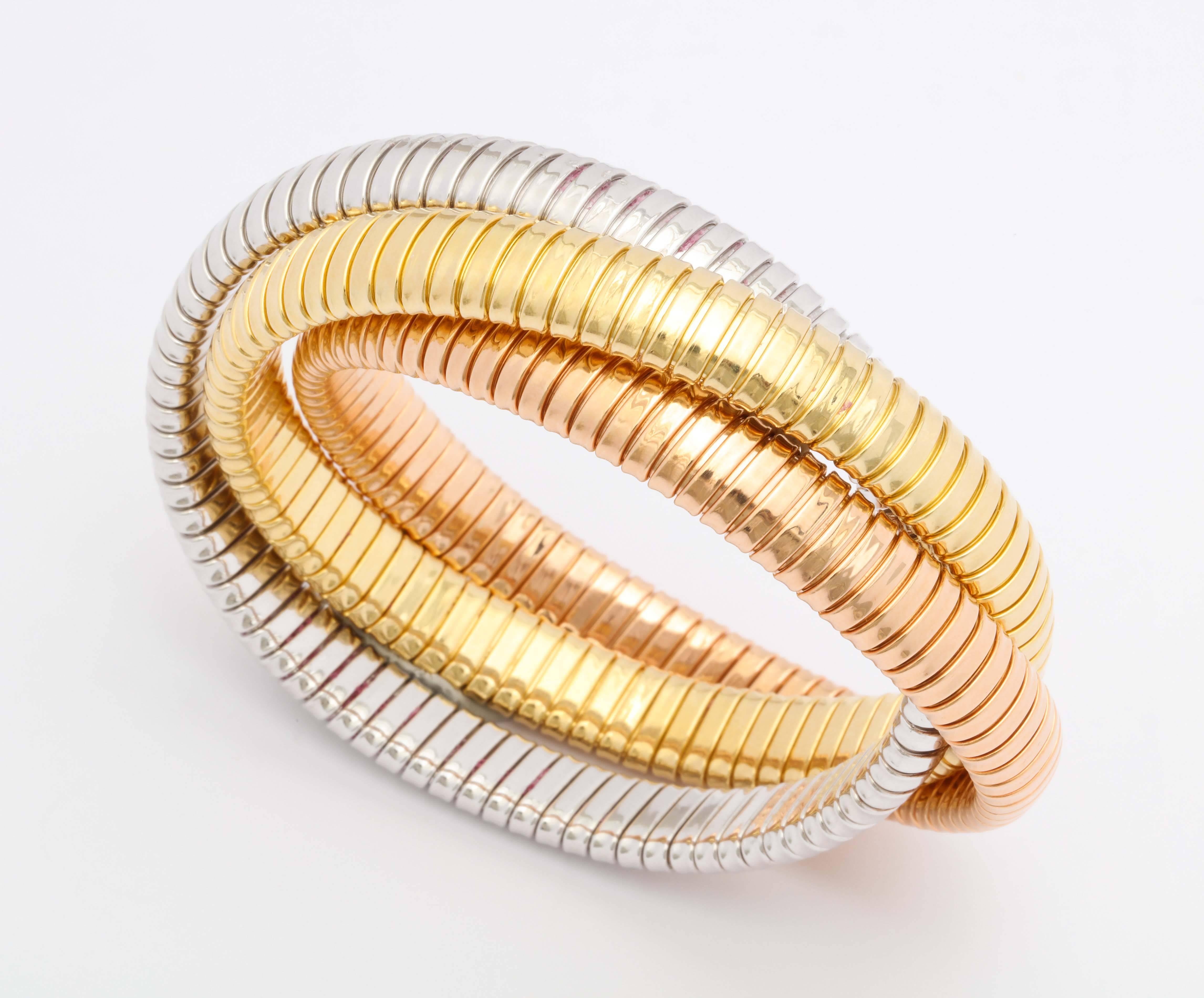 Three Color Gold Tubogaz Rolling Bracelet

3 bands 9 mm each. 17 cm circumference