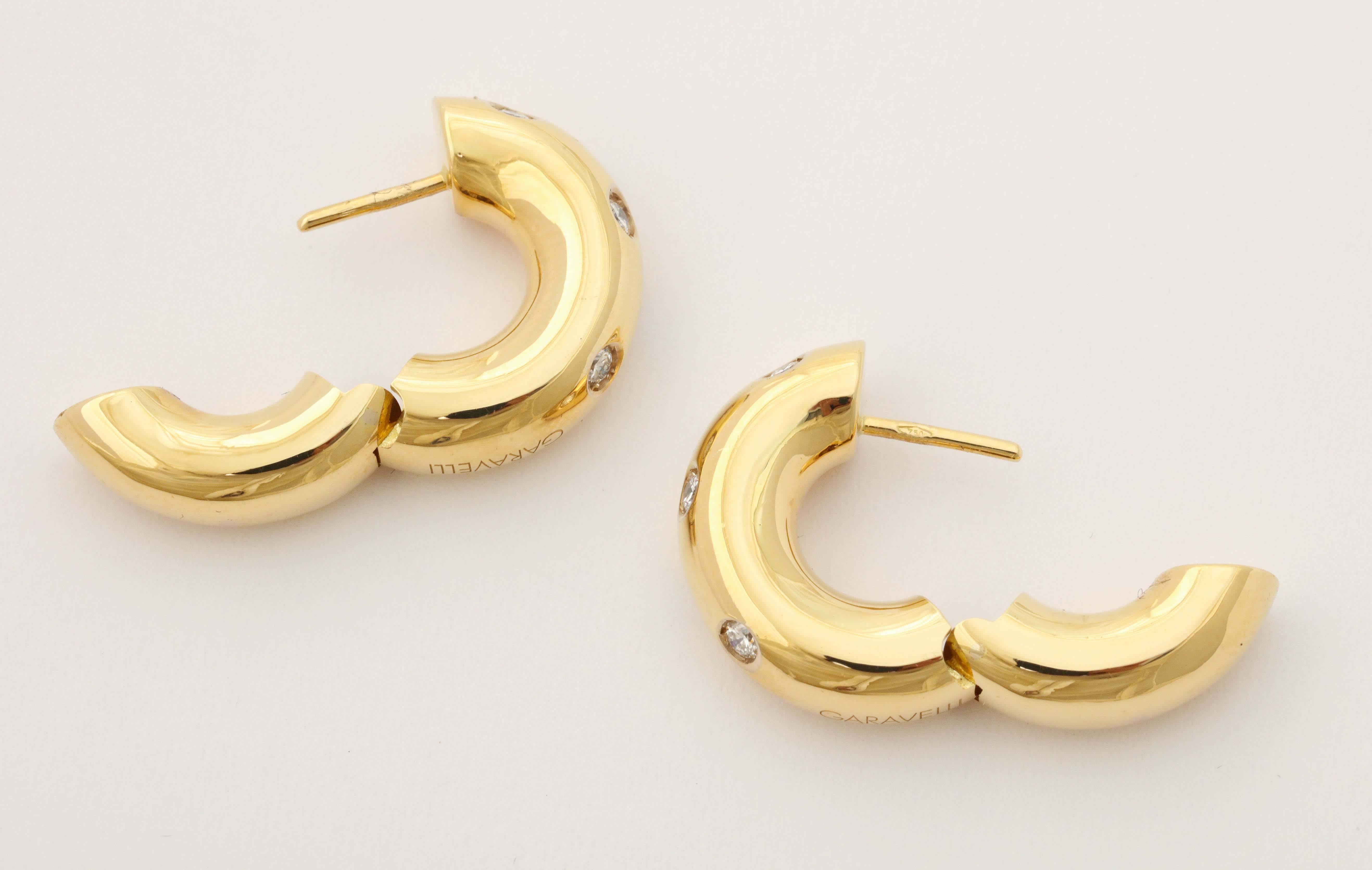 18k yellow gold burnished diamond hoop earrings. 

10 Full cut diamonds - 0.40 total weight

