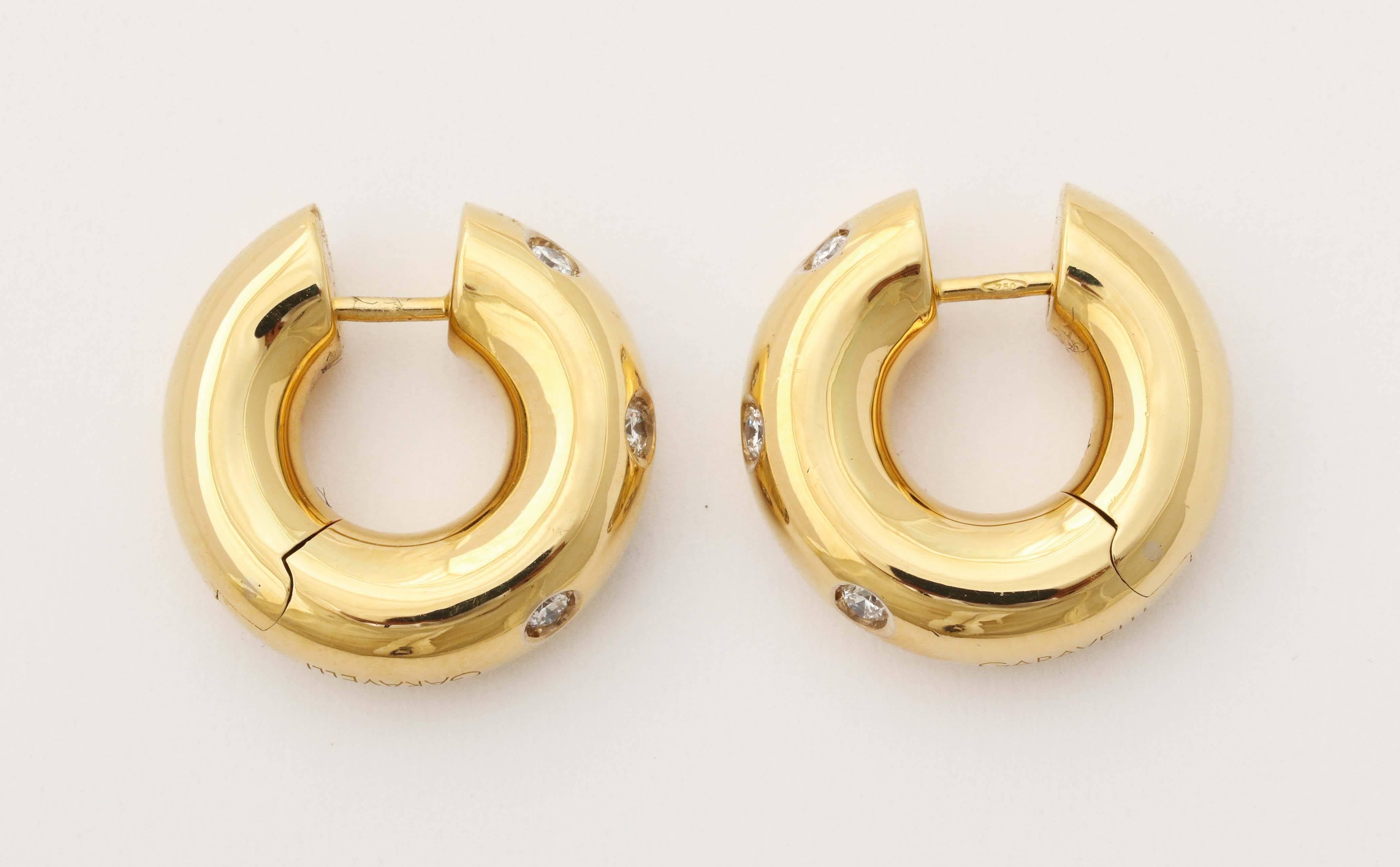 Contemporary gold diamond tubular hoop earrings 