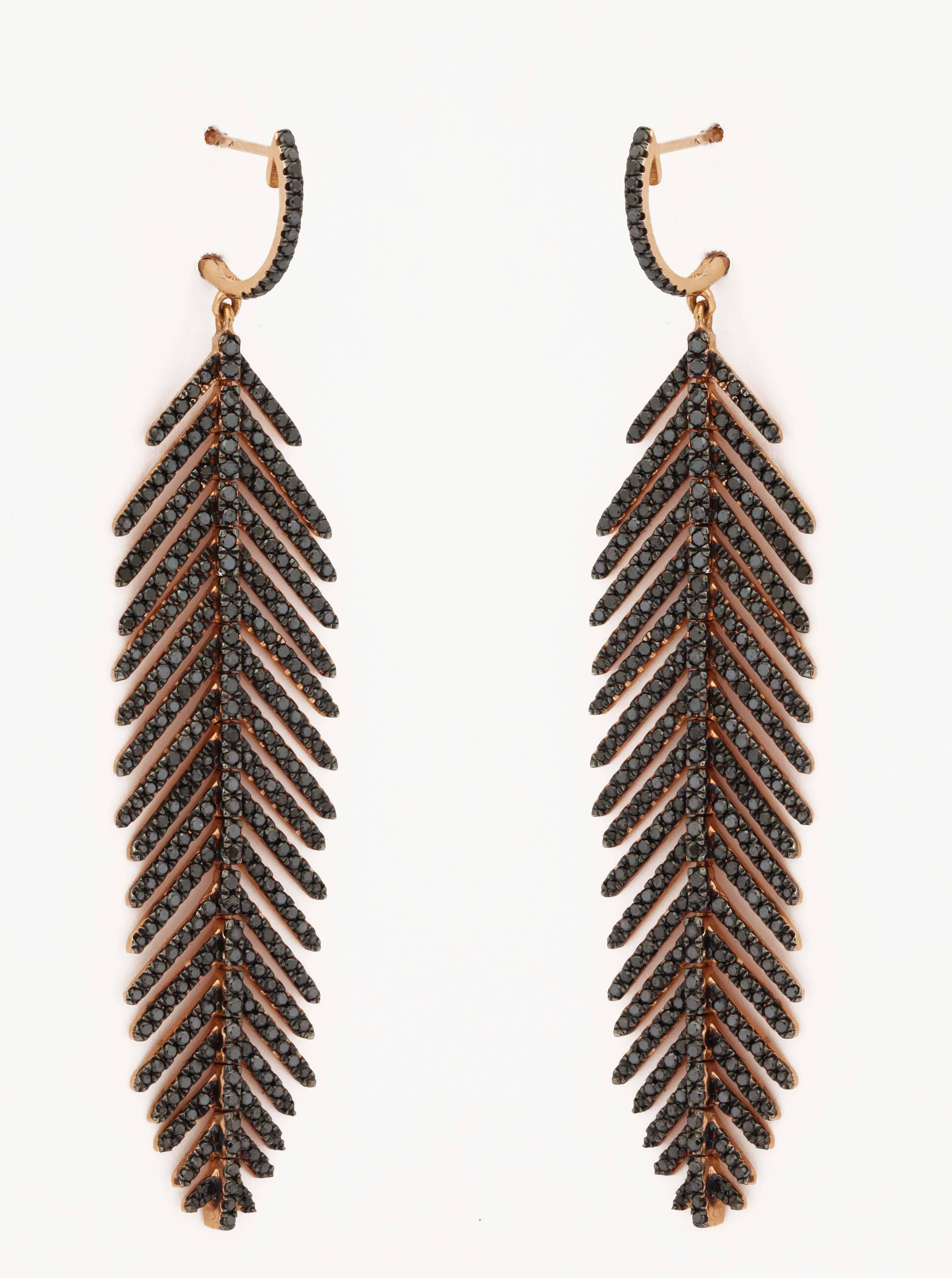 these elegant 18k rose gold and black diamond feather earrings contain
562 round black diamonds 3.25 carats and have a total weight of 
15.6 grams each
