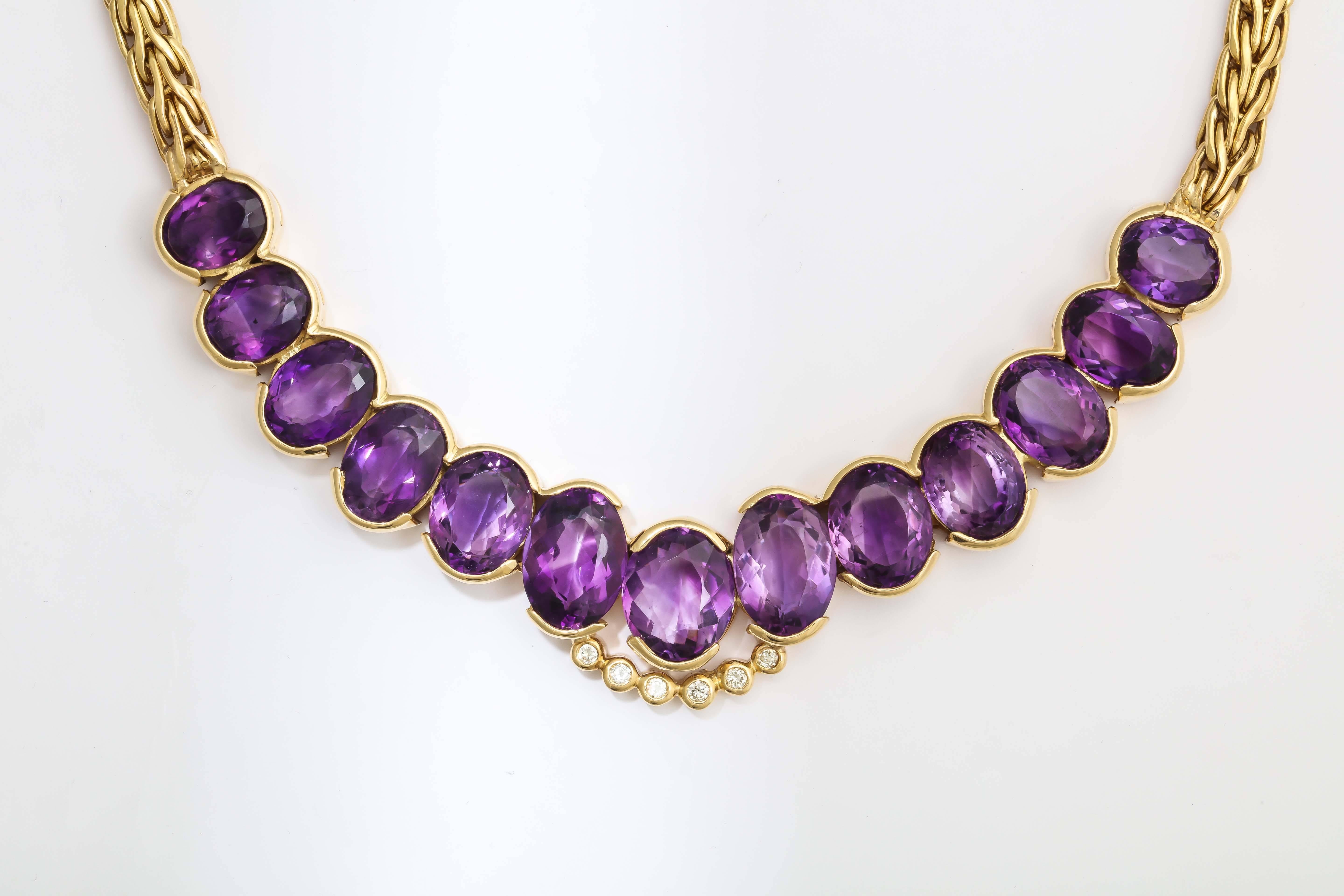 18kt Yellow gold Cable Link Necklace Embellished With 13 Faceted Beautiful color Amethyst stones Weighing Approximately 60 carats. Further Decorated With 6 full cut diamonds weighing .50cts. Made With A Beautiful Fancy Clasp With 1 Cabochon Sapphire