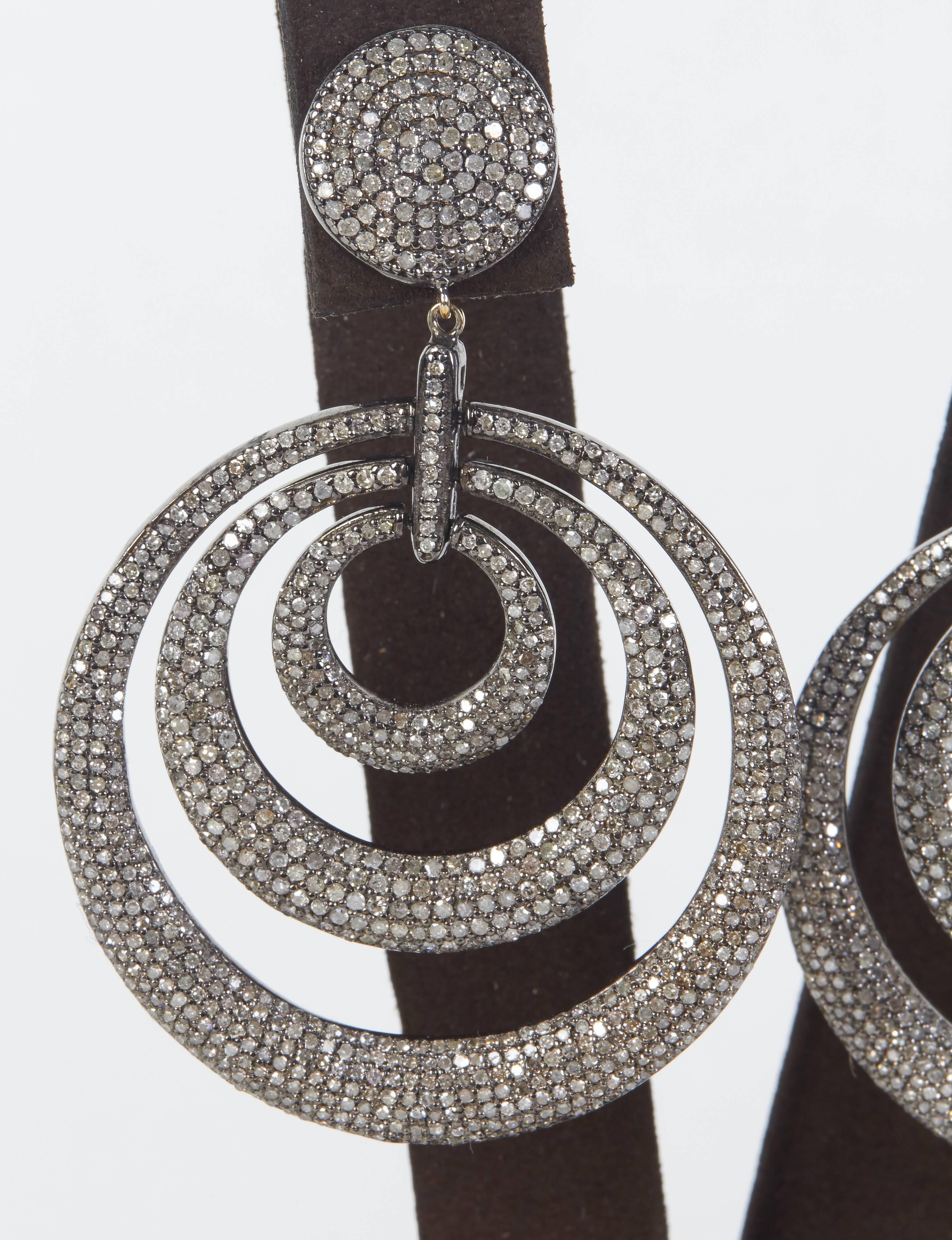 

Amazing statement earrings!

7.54 carats of sparkle set in 14k yellow gold and silver. 

These earrings have beautiful movement, please call for more information.

Approximately 2.44 inches in length and 1.7 inches at its widest point.  