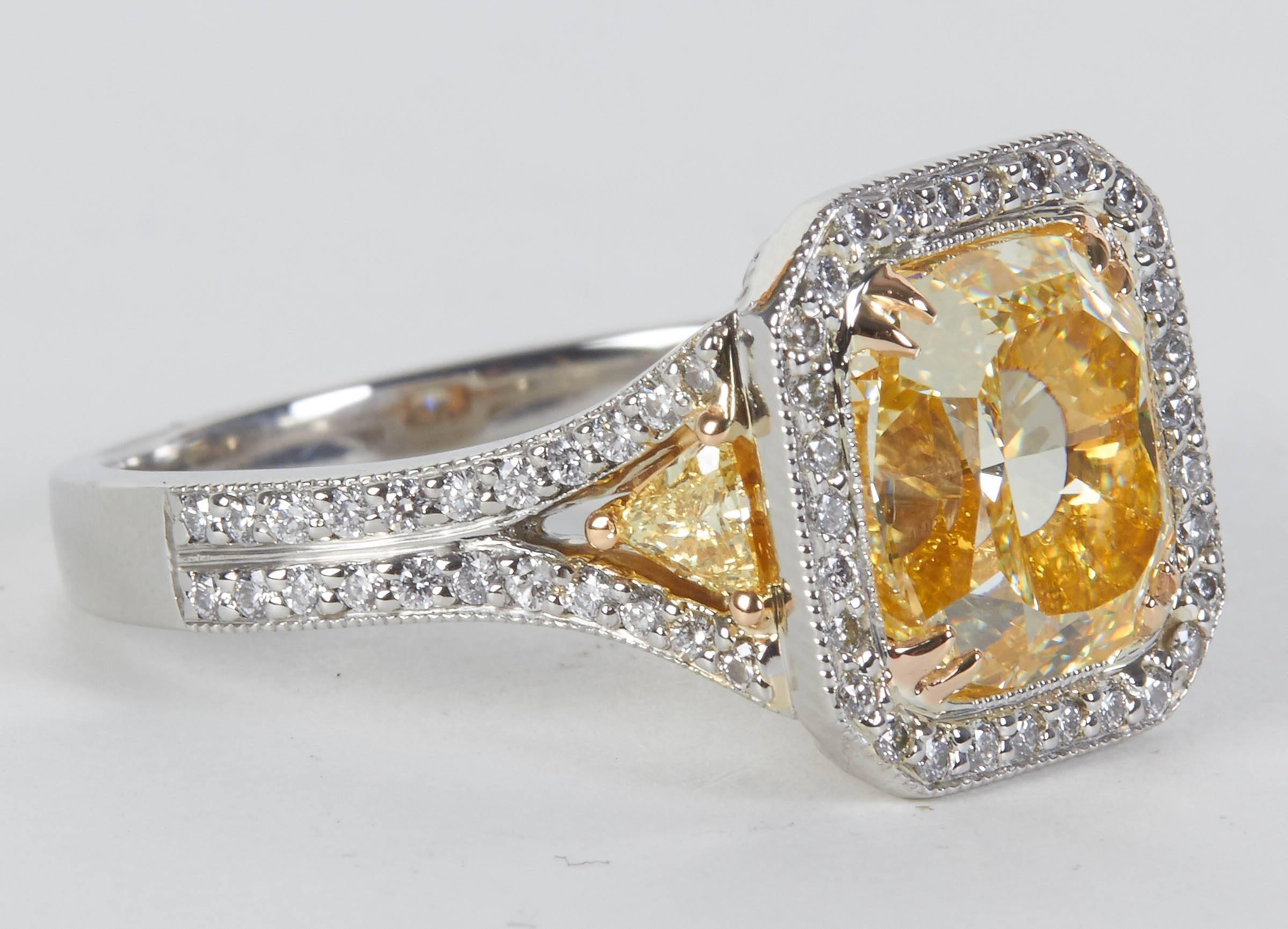 
Rare Internally Flawless Yellow Diamond Ring!

A gorgeous and brilliant yellow diamond set in a unique handmade diamond ring. 

4 carat GIA certified Fancy Light Yellow, INTERNALLY FLAWLESS!!

.71 carats of white and yellow diamonds set in