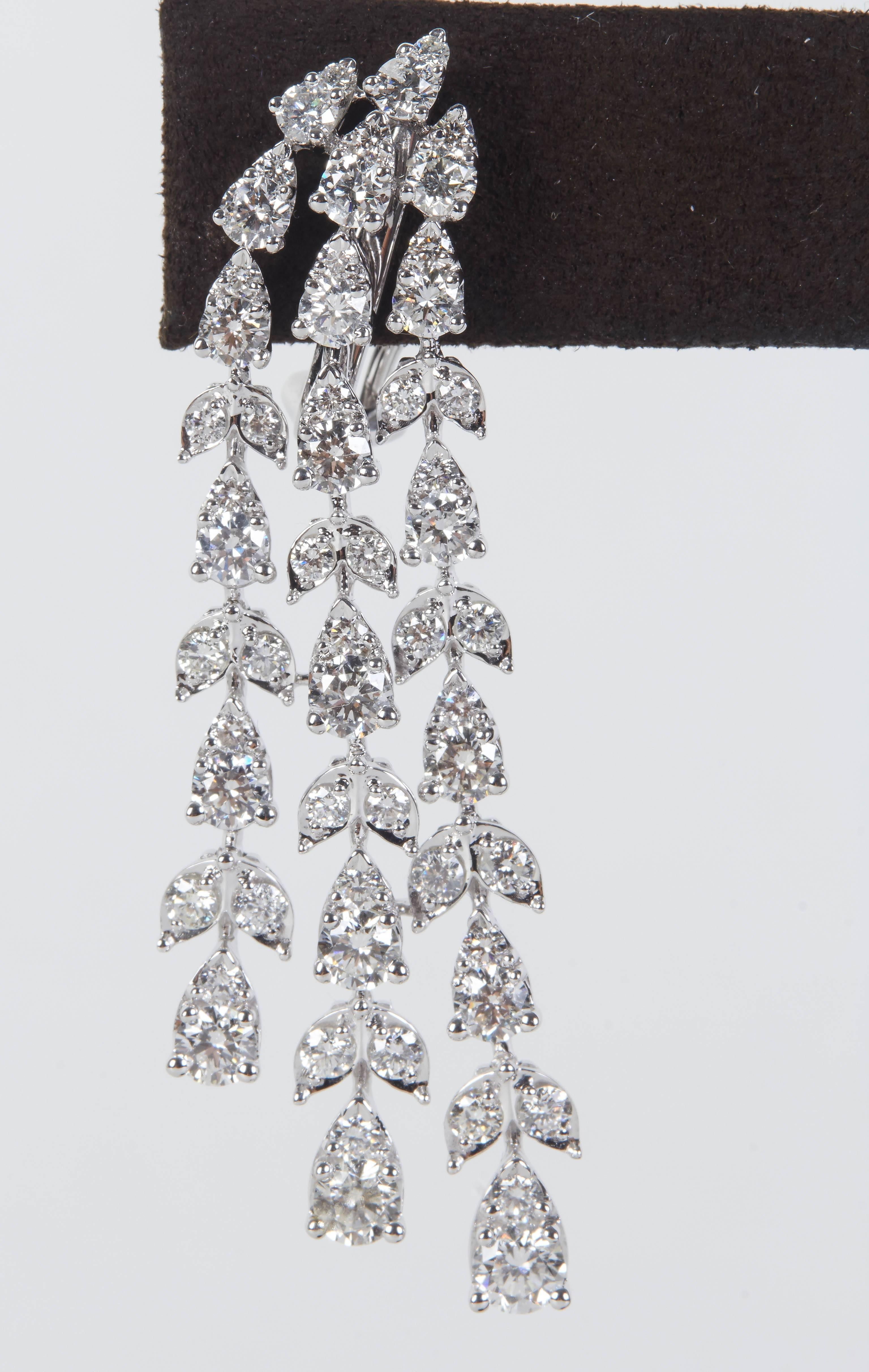 

A stunning pair of earrings!  Almost 7 carats of sparkle!

6.87 carats of round brilliant cut diamonds set in pear and marquise shaped 18k white gold. The round stones give the earrings more sparkle and a unique look.

Approximately half an