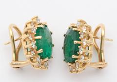 Oval Emerald Diamond Gold surround Earrings