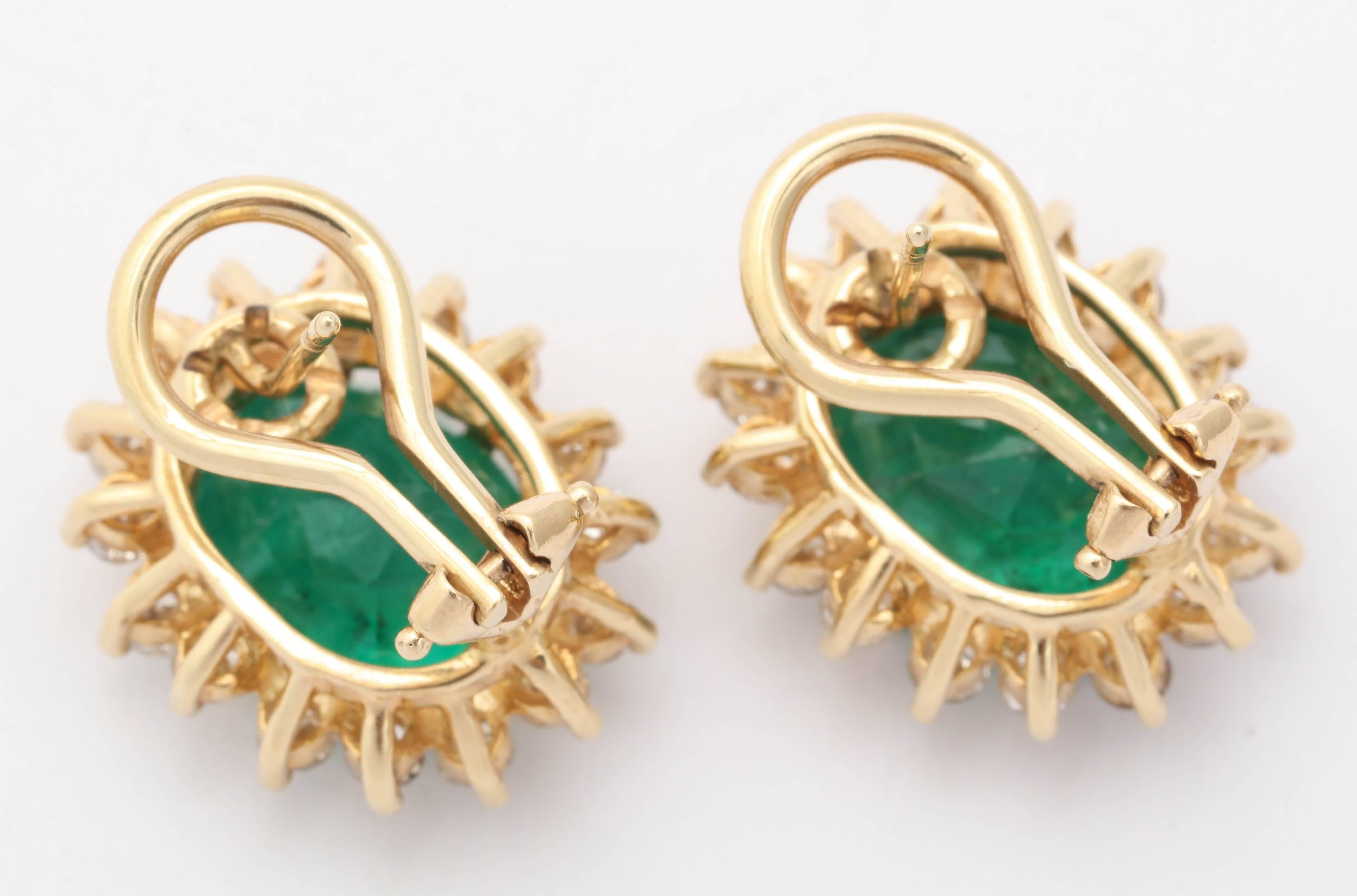Oval Emerald Diamond Gold surround Earrings In Excellent Condition In New York, NY