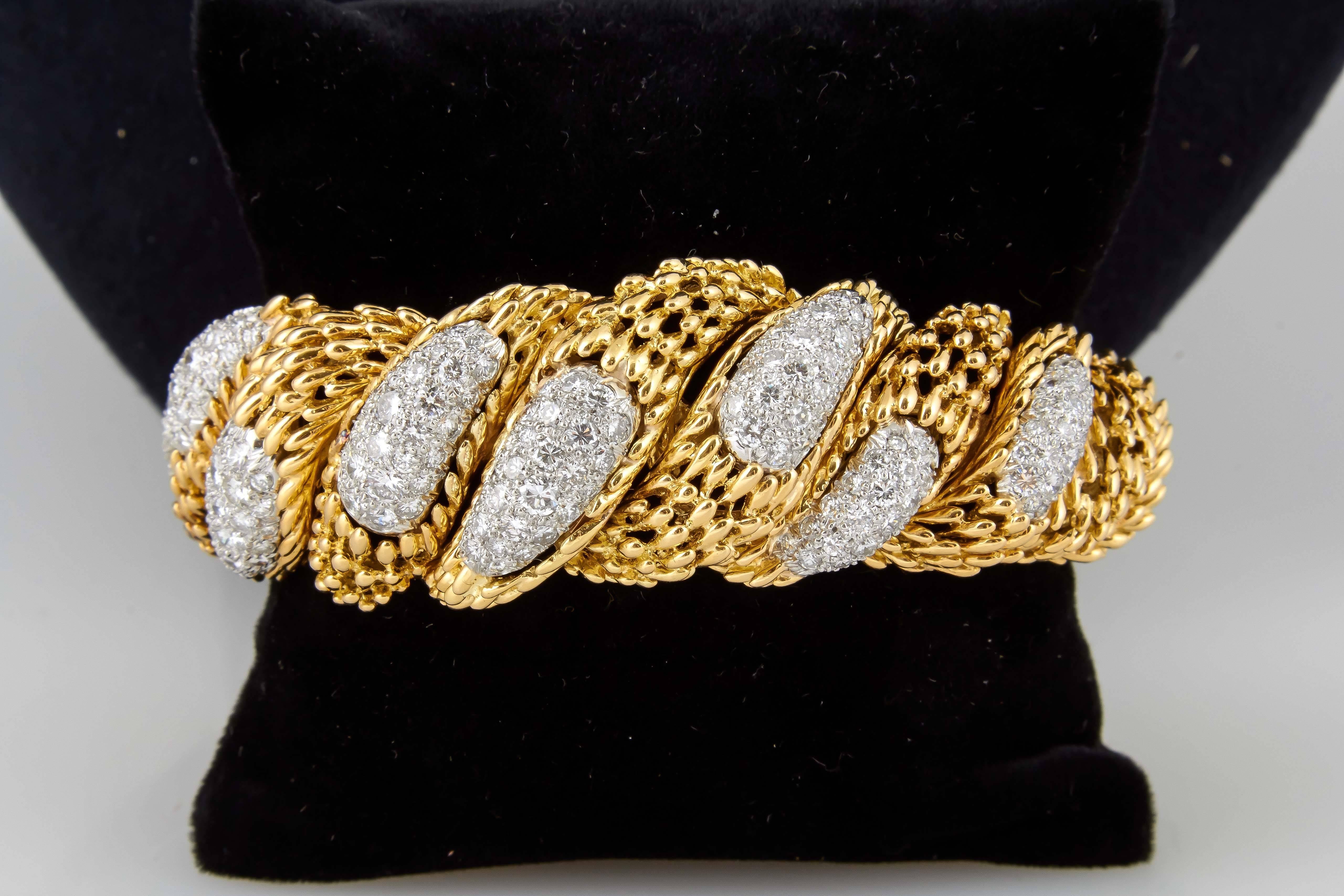 Beautiful bracelet finely crafted in 18k yellow gold with diamonds weighing approx. 11.00 carats signed by Hammerman Brothers.