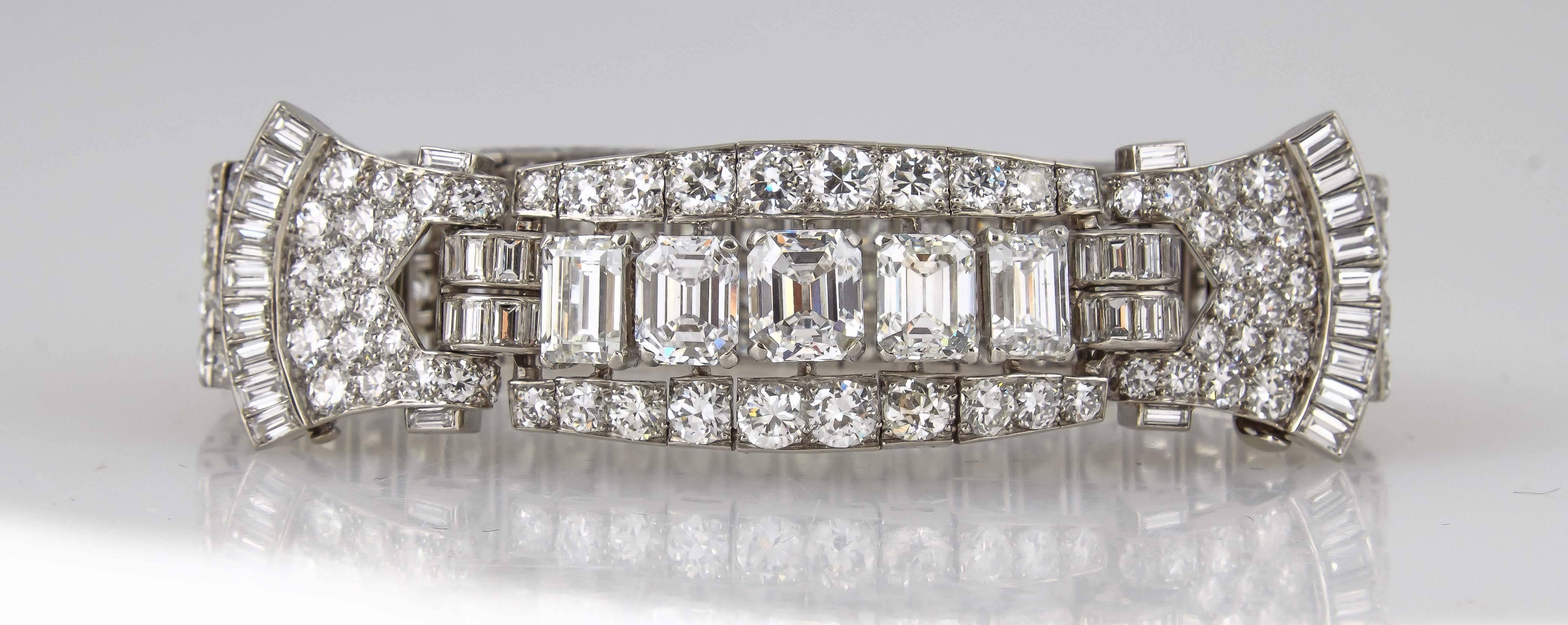 Fantastic Art Deco bracelet, centering  5 emerald-cut diamonds  weighing a total of  7.72 carats certified by GIA, surrounded by  a mix of round and emerald cut diamonds weighing a total of approximately 23.00 carats. 