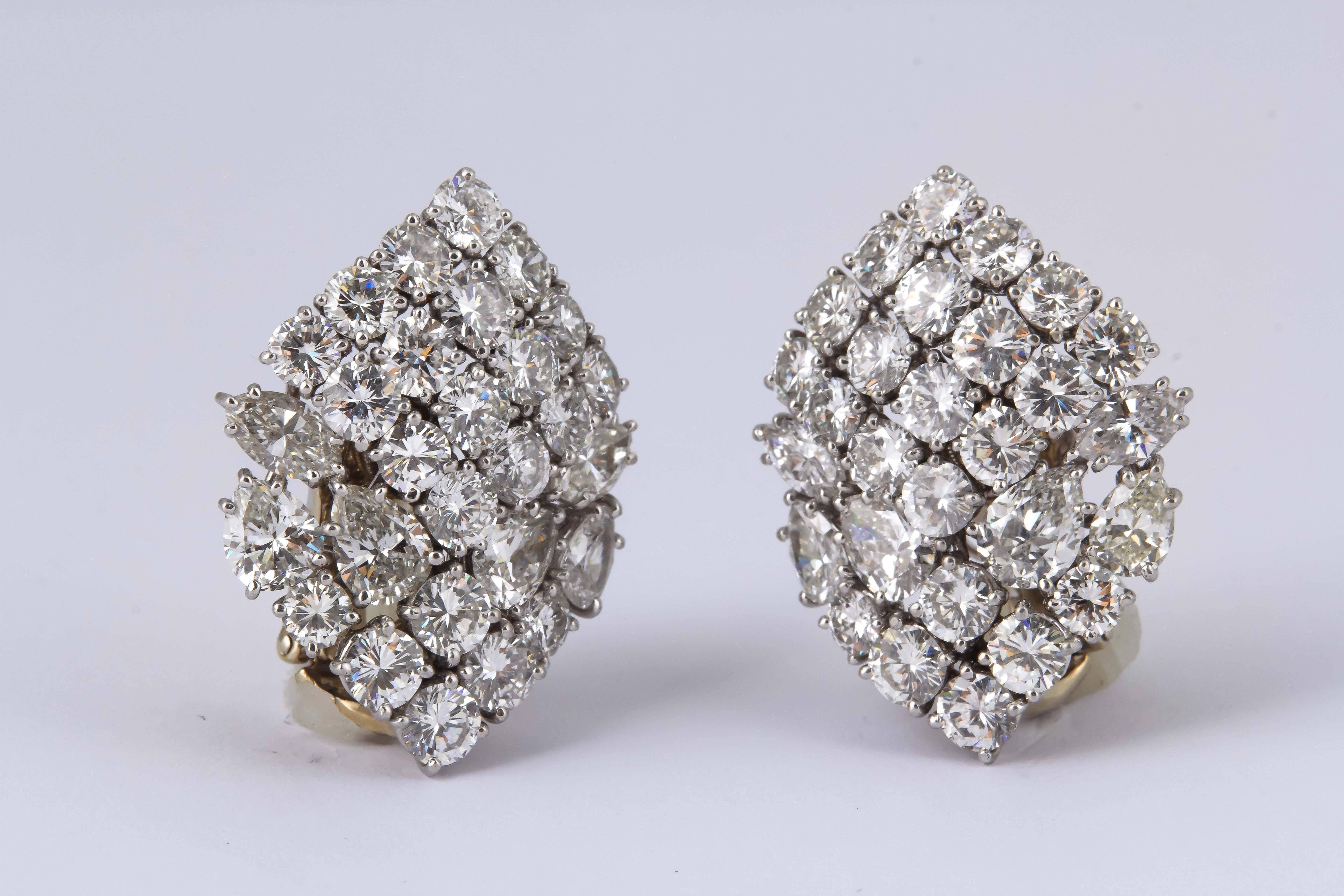 This statement earrings created by iconic jewelry designer David Webb, immediately attract attention, total of 20.00 carats in round, marquis and pear-shaped diamonds. Finely-crafted in platinum, circa 1960.