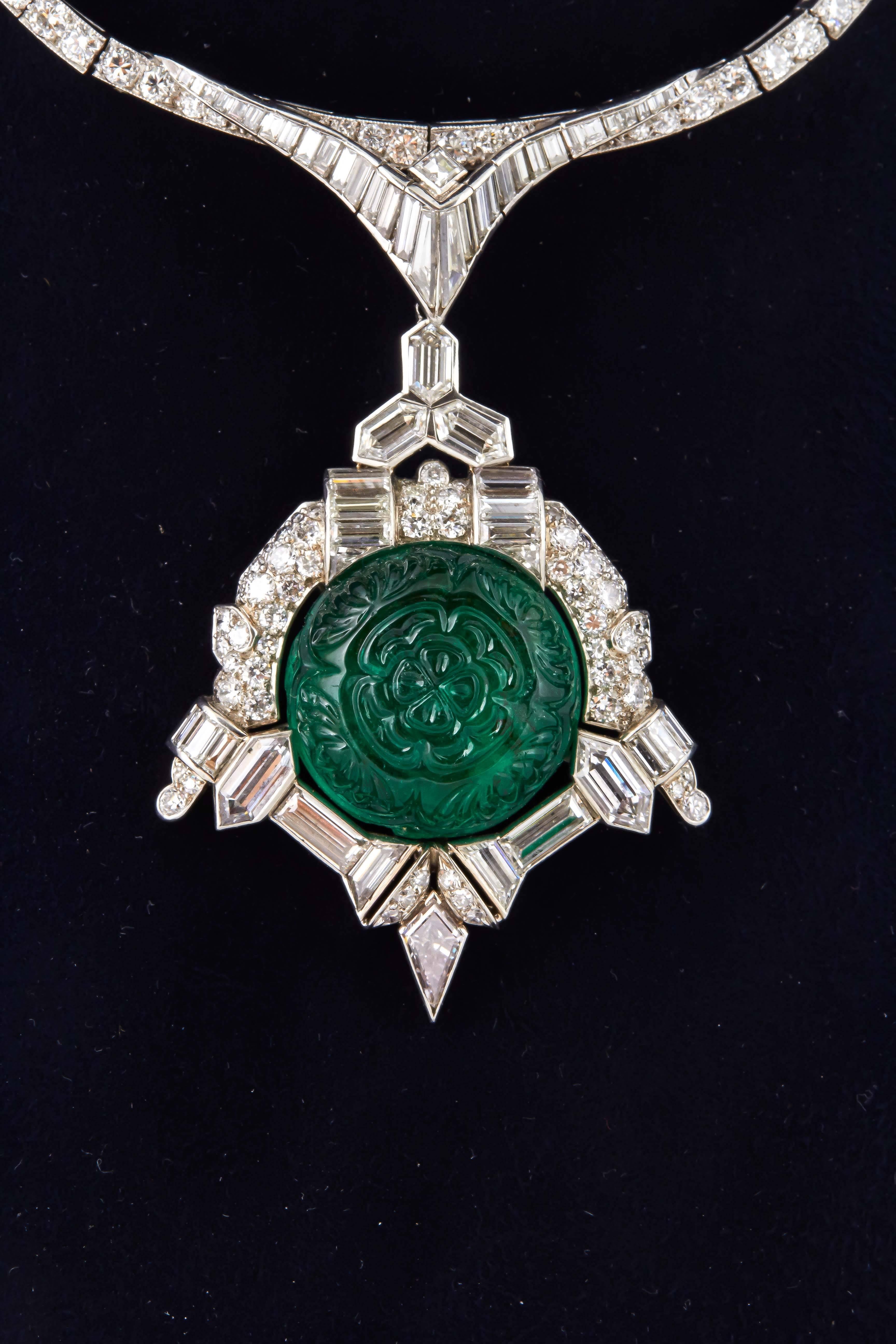 This is a beautiful and unique Antique Art Deco necklace  finely crafted in Platinum with diamonds and detachable diamond and emerald pendant . Carved emerald weighs approximately 35.00 carats and diamonds weighing a total of approximately 30.00