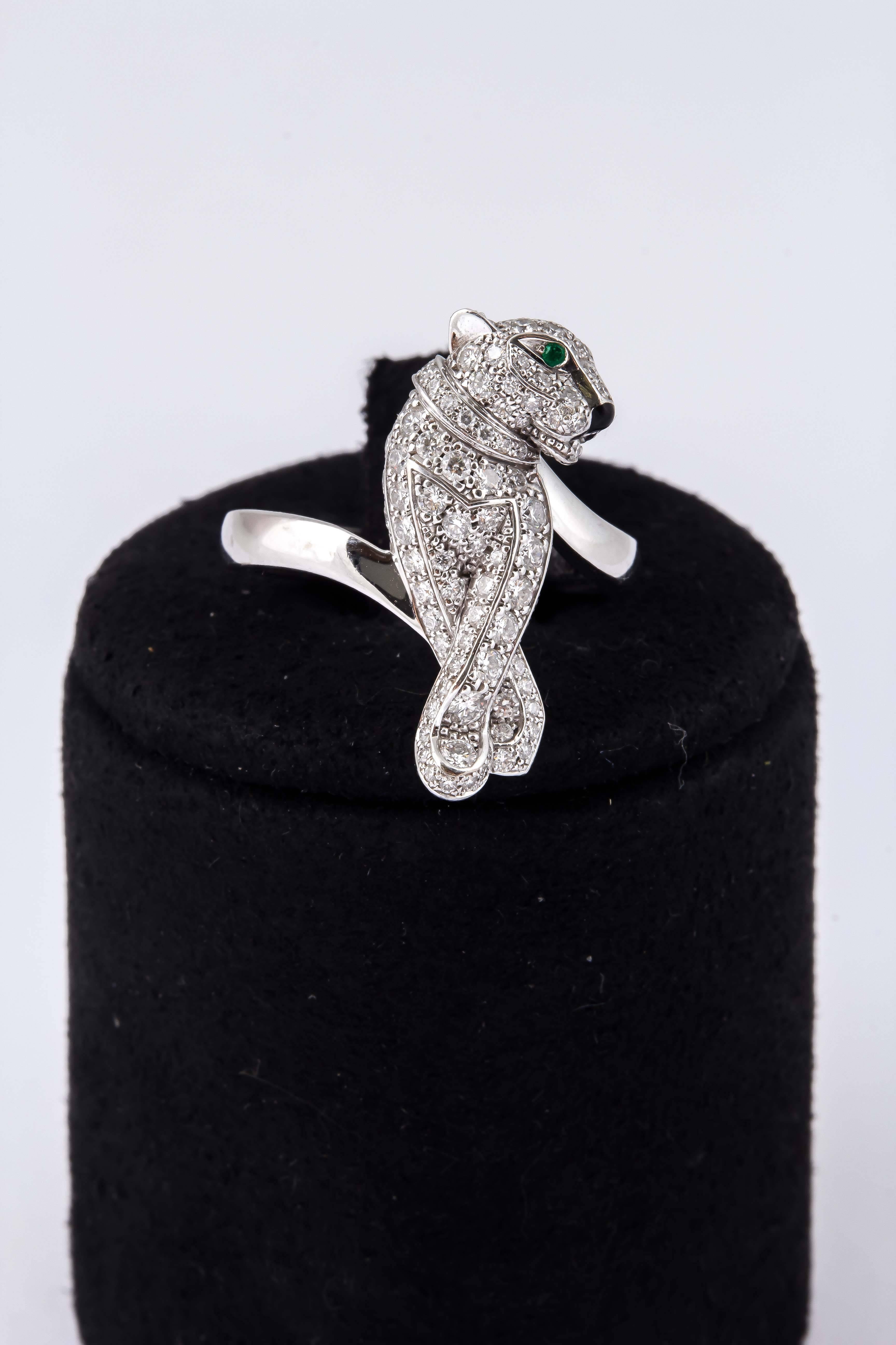 Panther ring, finely crafted in 18k white gold with diamonds, emeralds and black enamel. Signed Cartier. Serial number WI5025