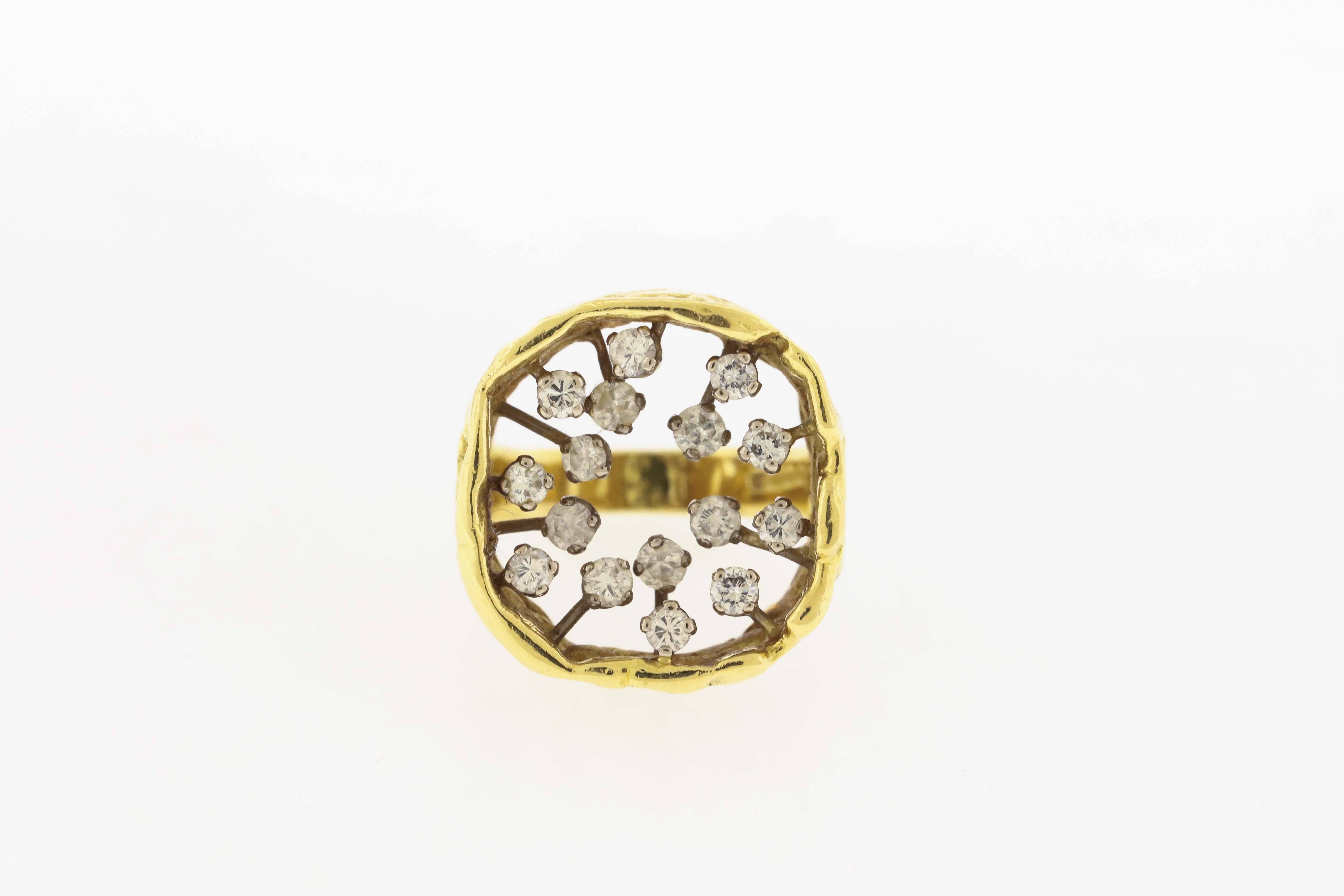 18K yellow gold ring by famed mid-century British goldsmith and studio jewelry John Donald, features approx.. 1.00 carat diamonds in an open cushion-shape square suspended above the finger, the ring in Donald's textured gold nugget style, made 1972.