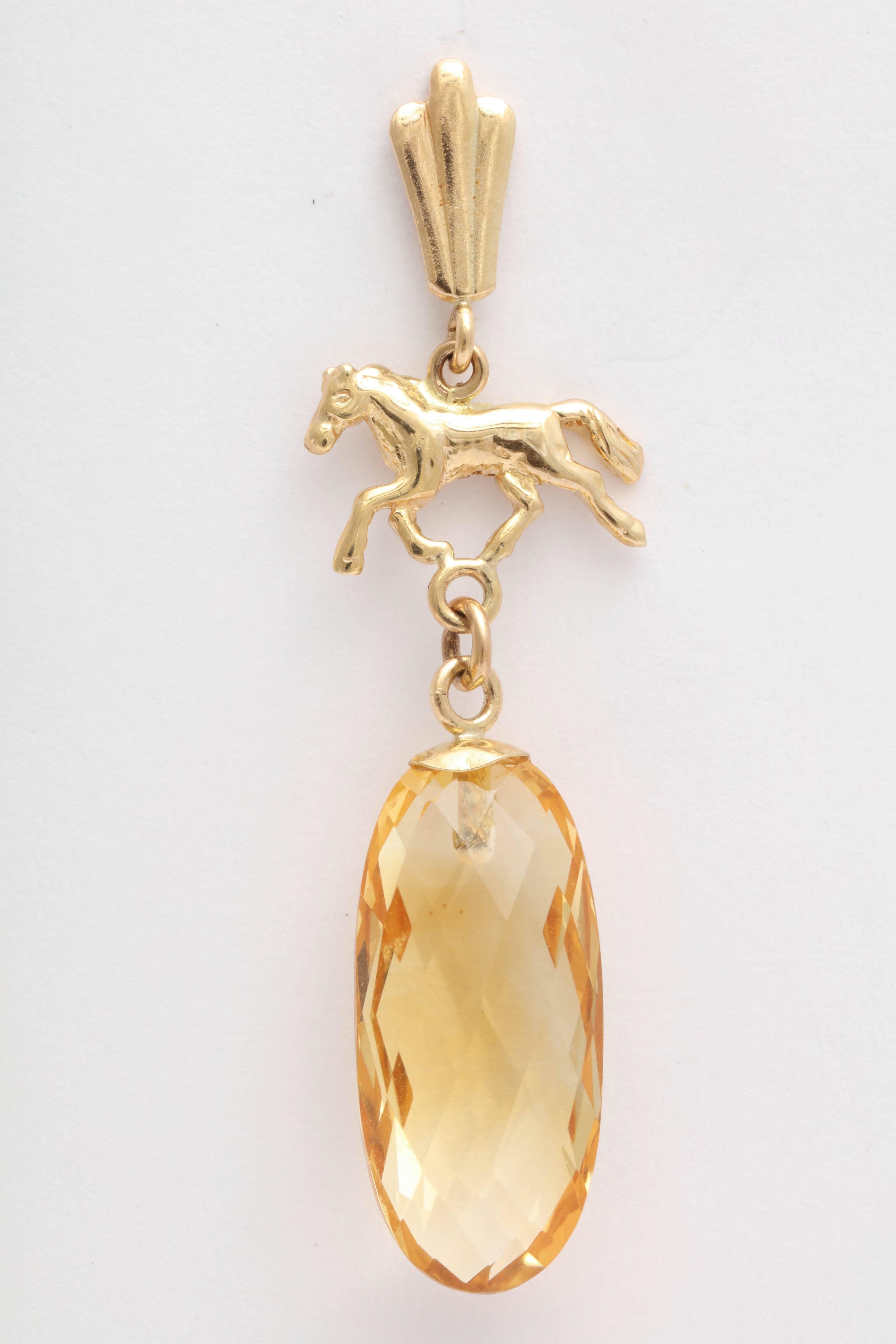 These earrings feature a classical trotting horse design with beautiful, faceted all around, citrine briolettes. 