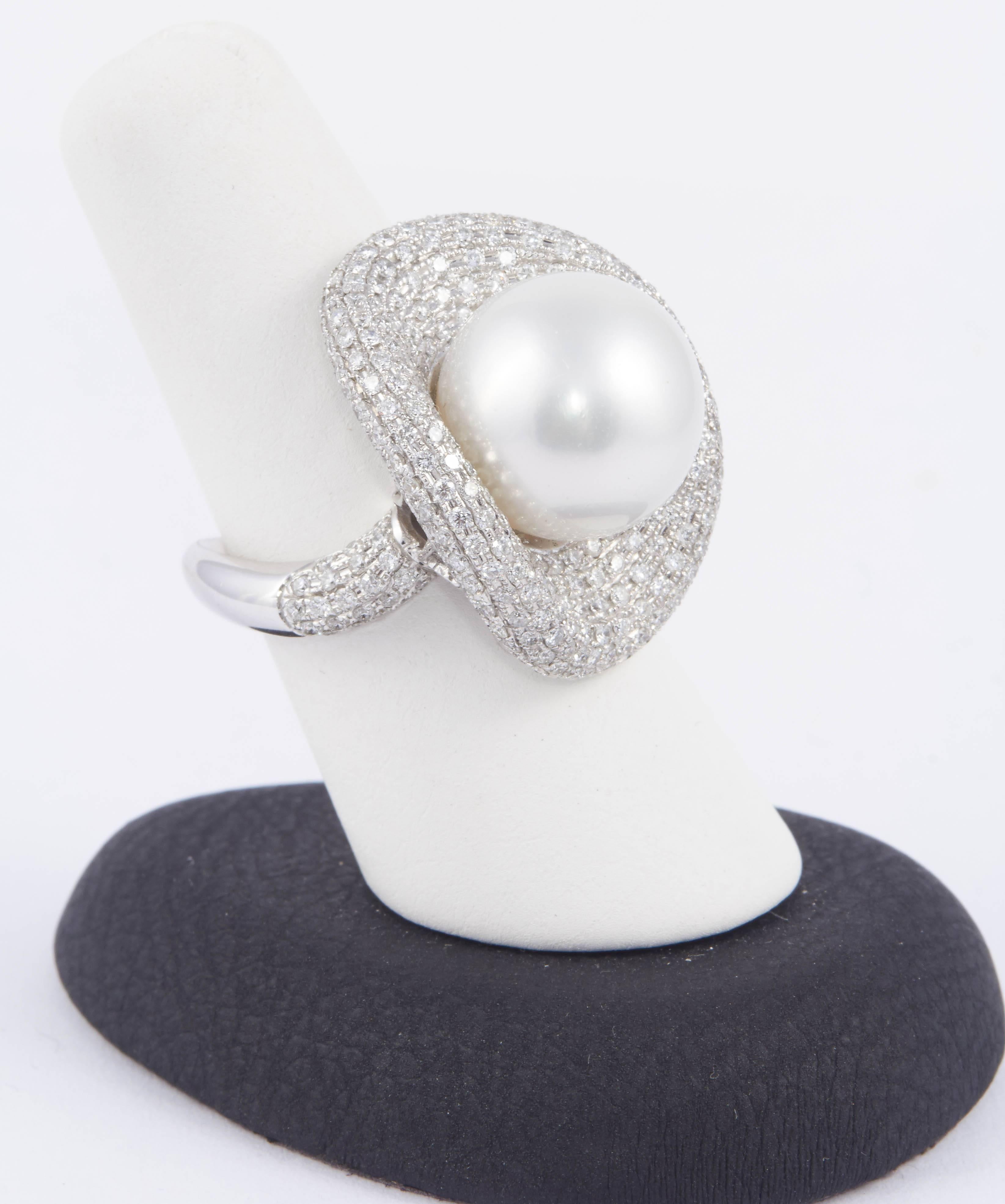 One of a kind
Diamond Weight: 2.48 Cts
18K white Gold
South Sea Cultured Pearl 13.7 mm
