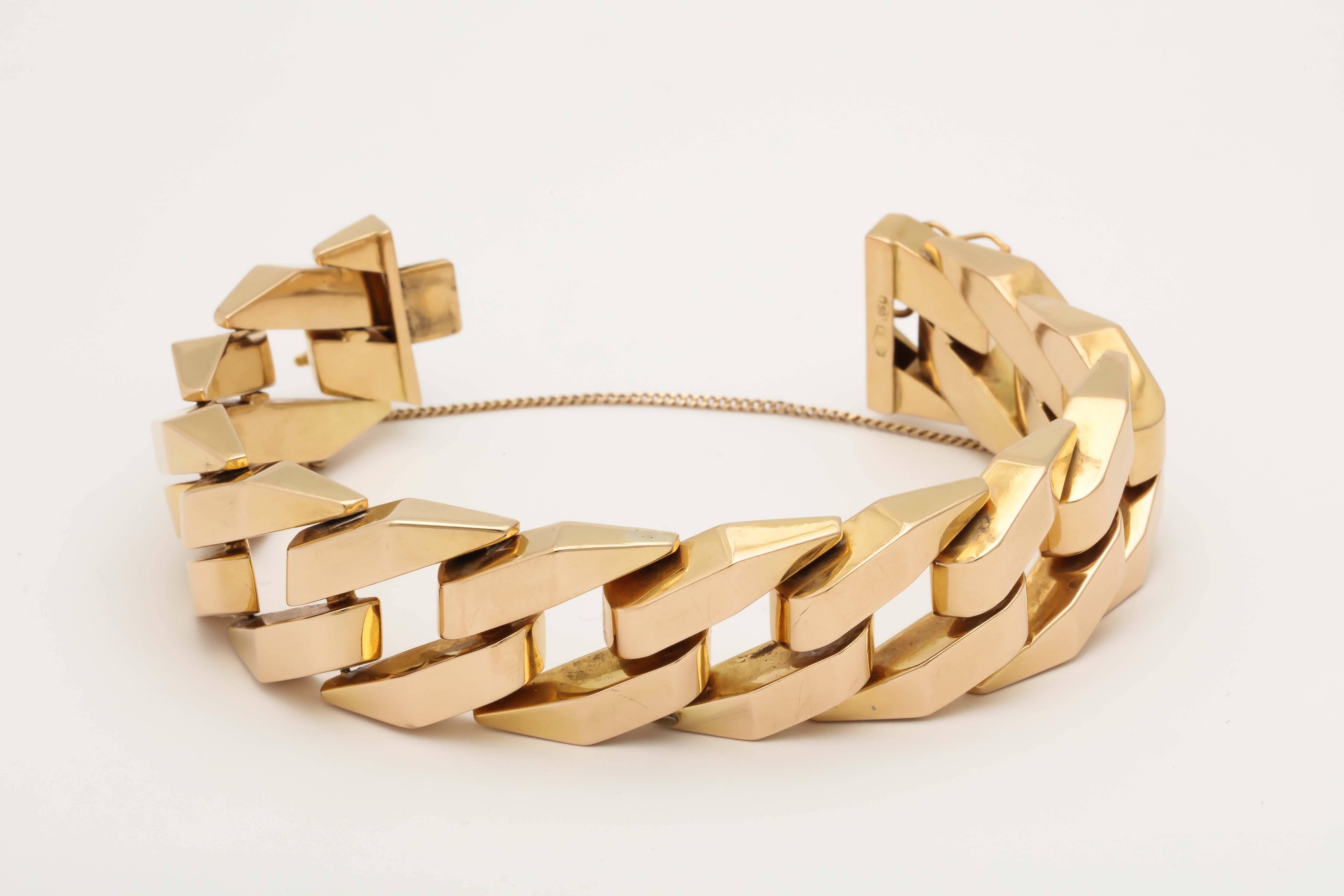 18kt Gold High Polish Open Link Bracelet Consisting Of !2 interlocking Jagged Links Measuring 7 inches Long. Italian Made In The 1960's. Made With 2 Figure 8 Safety Mechanisms And One Safety Chain For Extra Security.
