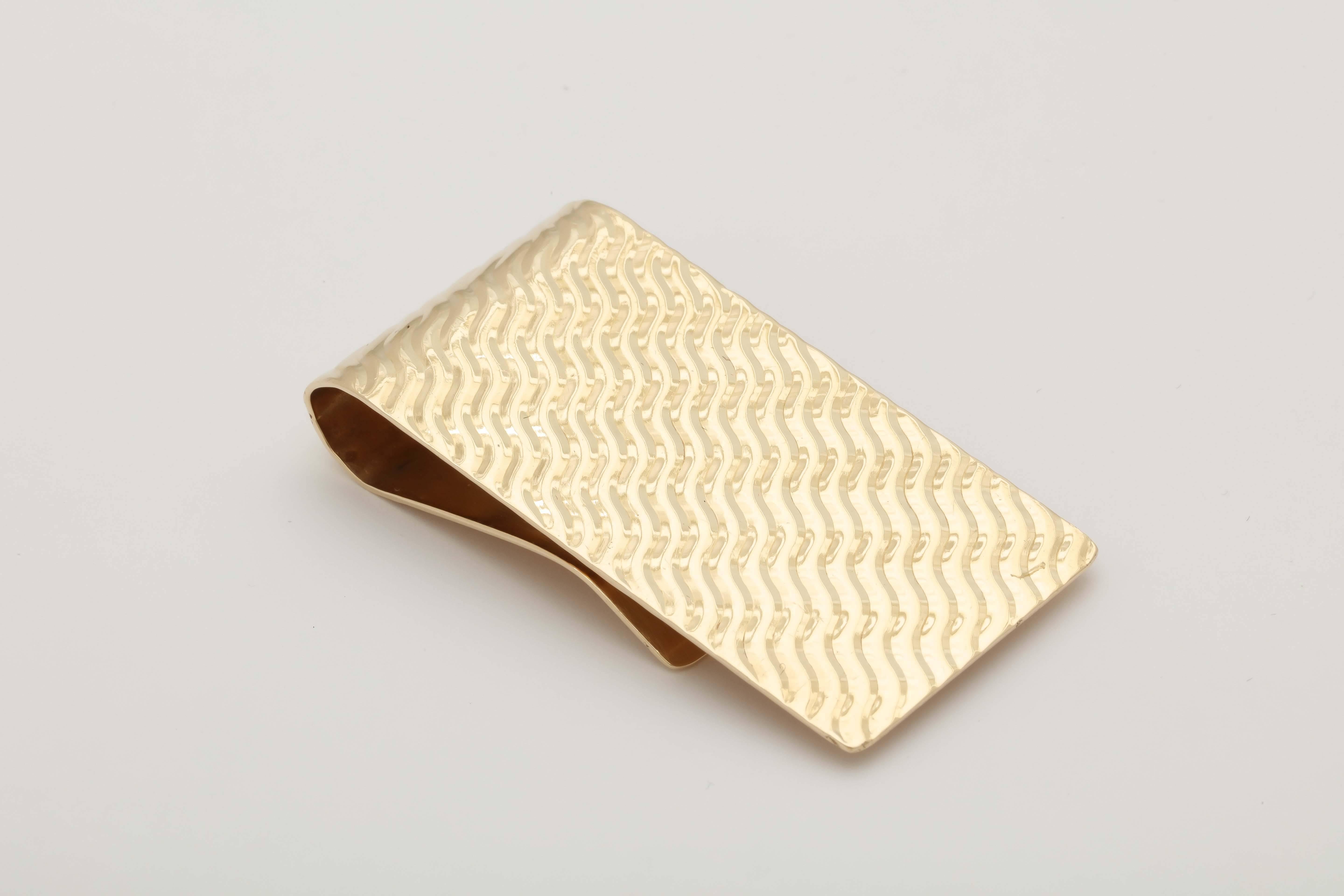 14kt Yellow Gold American Made Ridged Pattern Textured Money Clip Exhibiting A Diamond Cut Diagonal Design. This Is A Very Cool And Hip Money Clip.Signed By Cartier And Created In The 1940's.