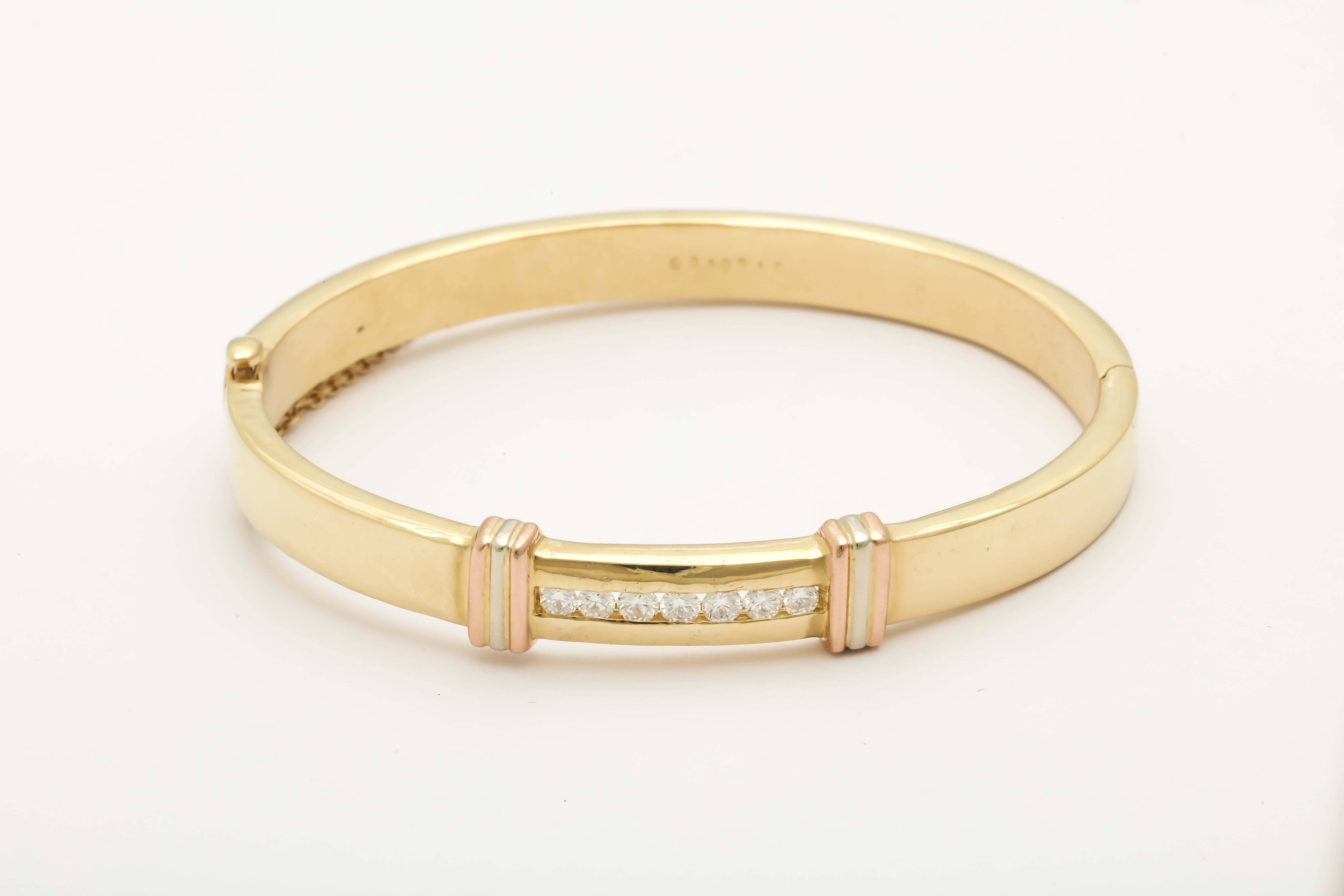 18kt Yellow,Pink,&White Gold Tri-Color Hinged Bangle Bracelet Designed With [8] Super High Quality Full Cut Invisible Set Diamonds. Bracelet Fits Standard Size Wrist And Is 2 & 1/4 Diameter Across. Fits An Average 7 Inch Wrist Size. Signed By