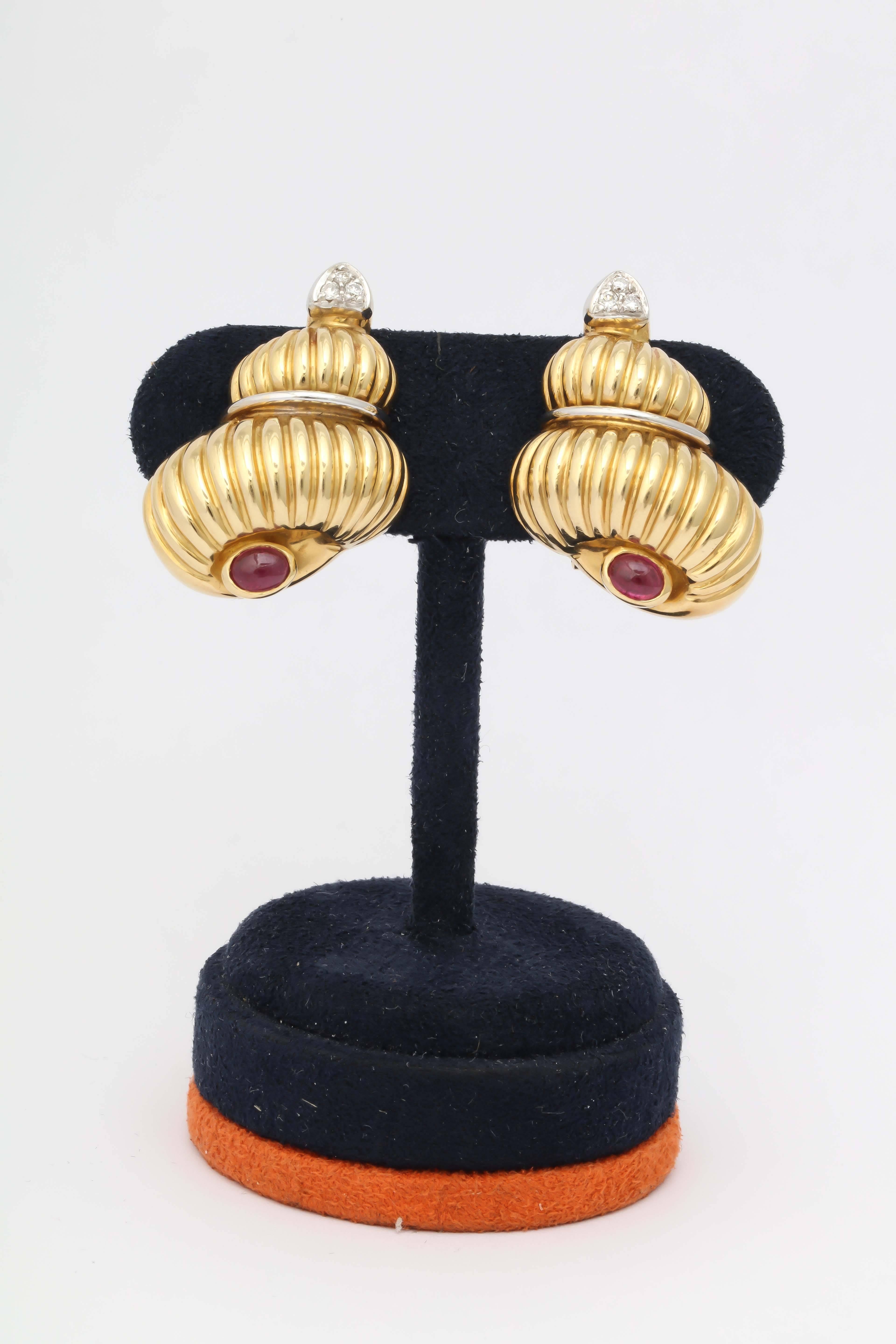 18kt Yellow Gold Figural Design Shell Earclips With Posts. Each Earring Designed With1 Cabochon Ruby And 3 Full Cut High Quality Diamond Embellishments. Made In ITALY in The 1980's.
