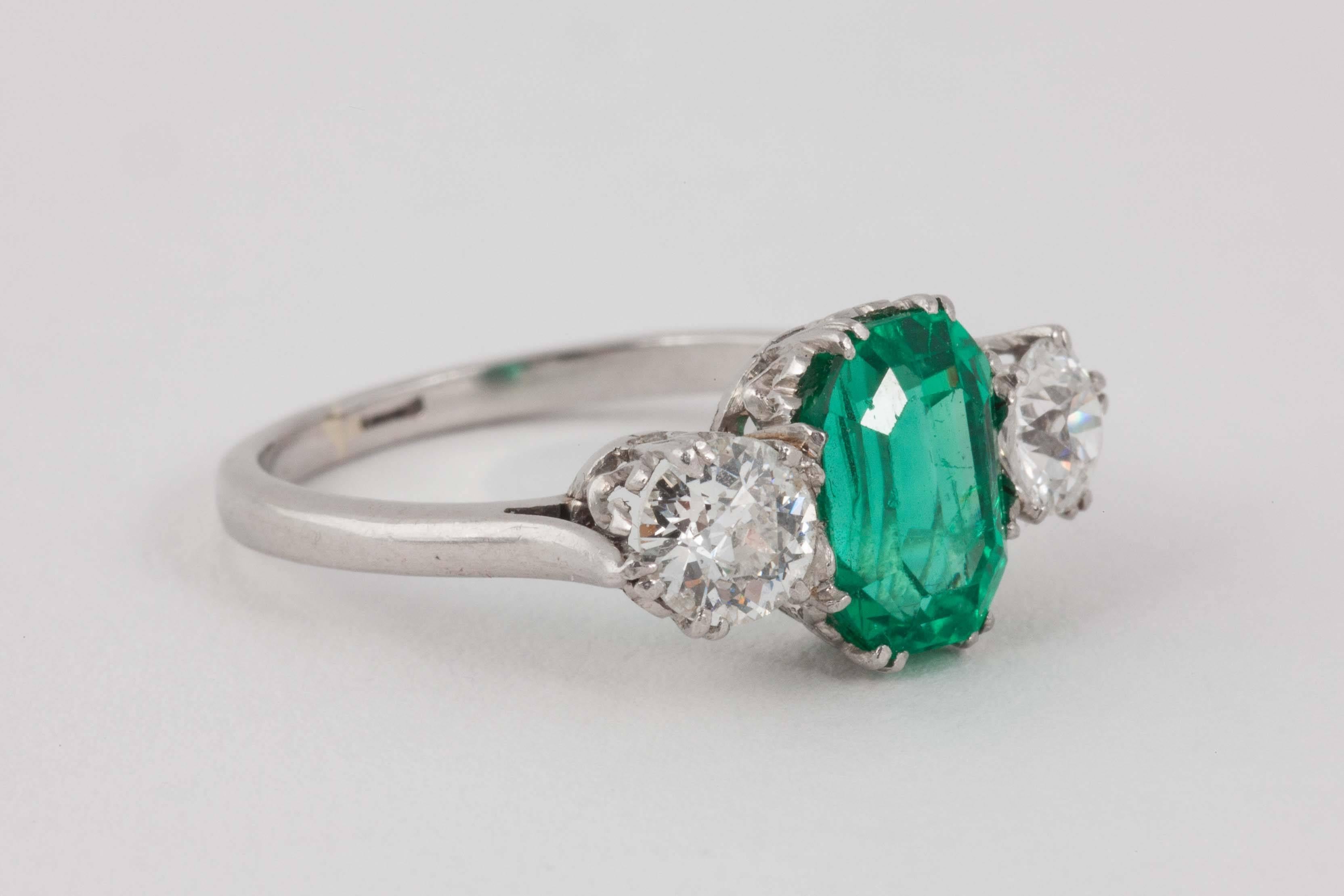 Platinum set 3 stone ring . Centre Emerald approx 2.5 cats and of Russian origin set between 2 Diamonds
Finger size N 1/2