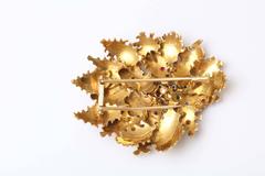 Blumenklammer aus Gold mit Rubinen, Saphiren und Diamanten