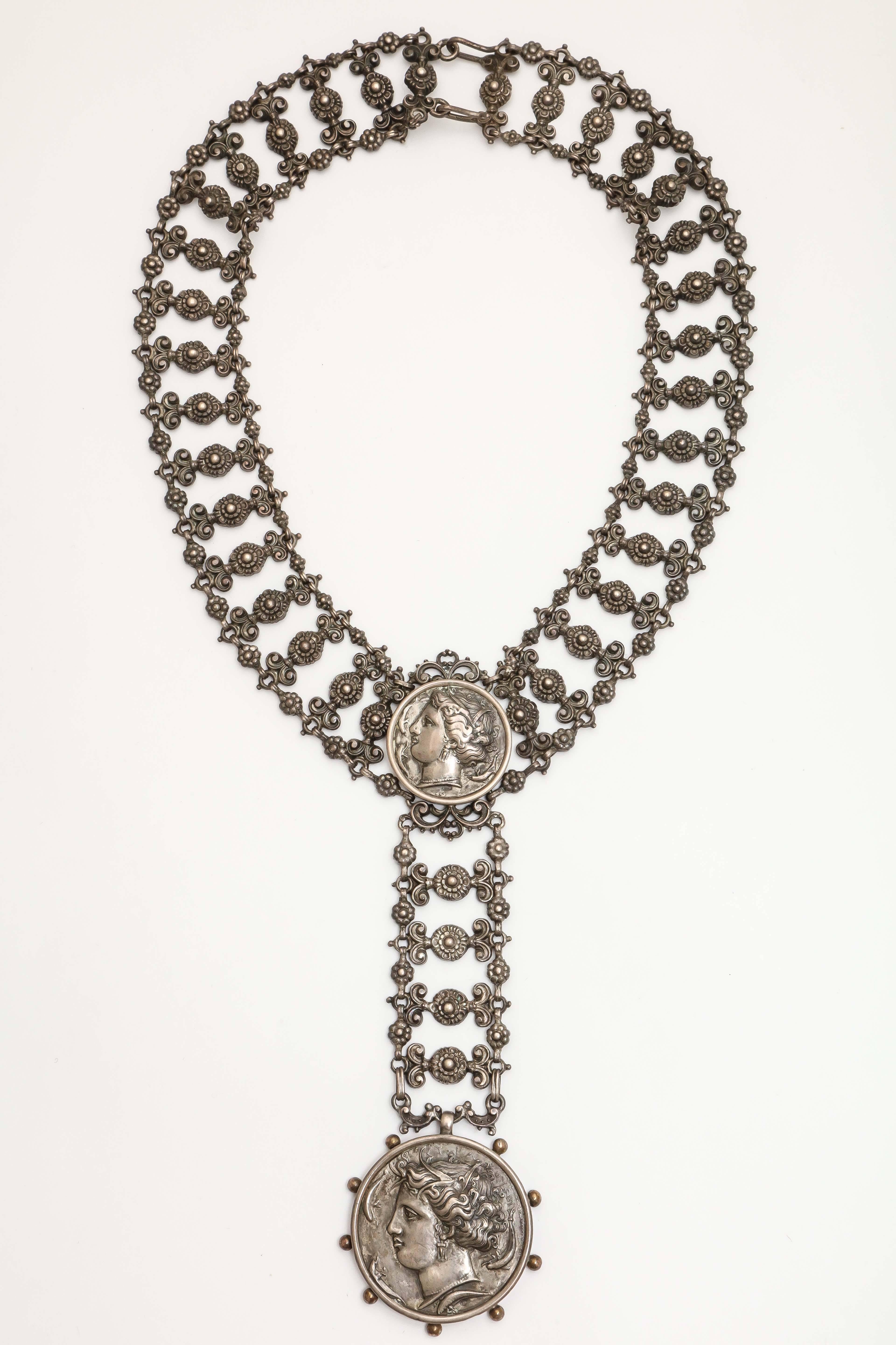 Important Necklace in an Ancient Style made out of Sterling Silver  with a facsimile of an Ancient Syracusan Coin.  Late 19th cent and typical of the type of Jewelry that was available on the Grand Tour and is still in style but un-available today.