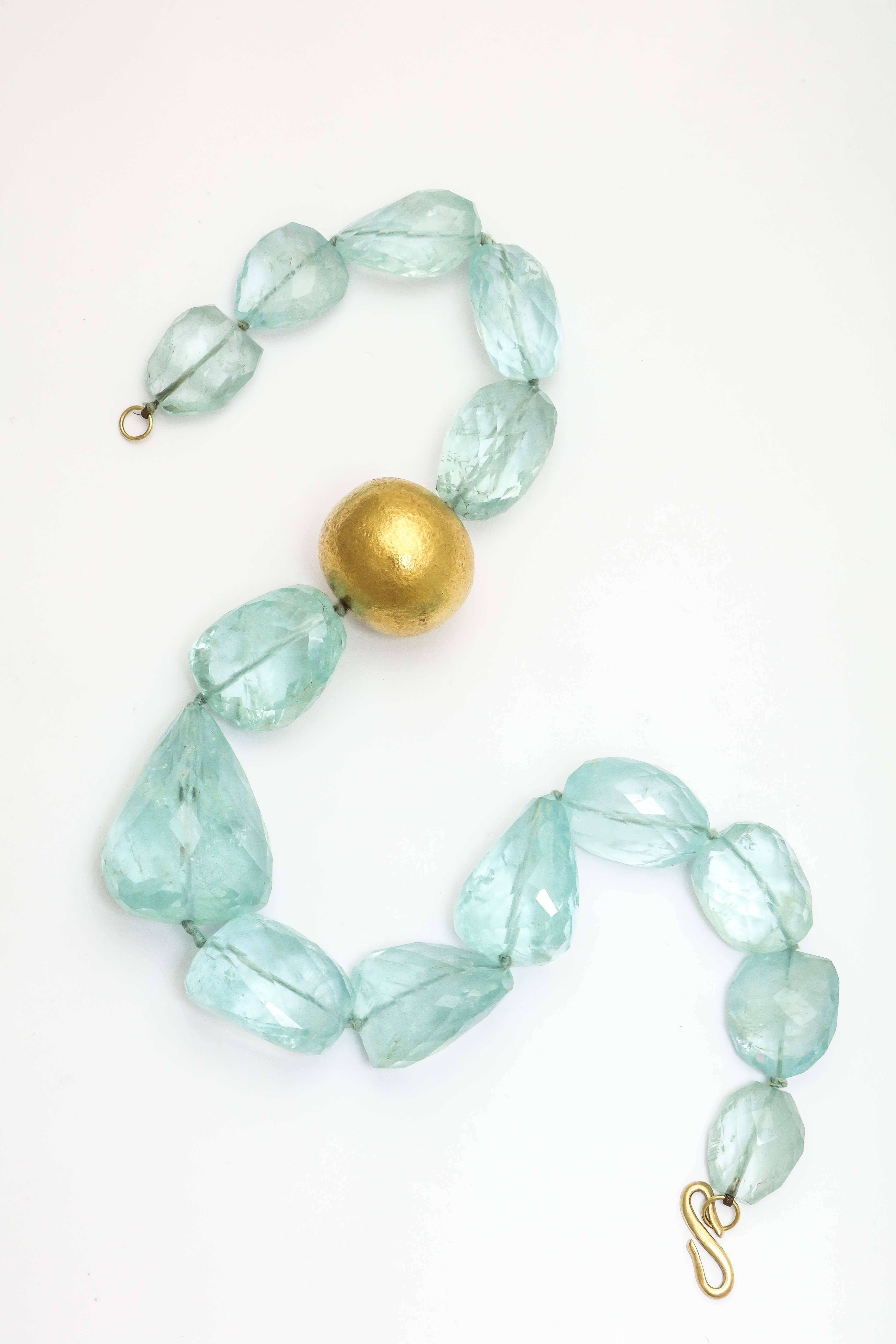 Super elegant Faceted Aquamarine & 18kt Yellow Gold hand hammered bead necklace.  The Aquamarines are graduated in six are total over 650carats. in weight.  The clasp is hand made and is marked 750 for 18kt.  SO elegant =- yet over the top.
  The
