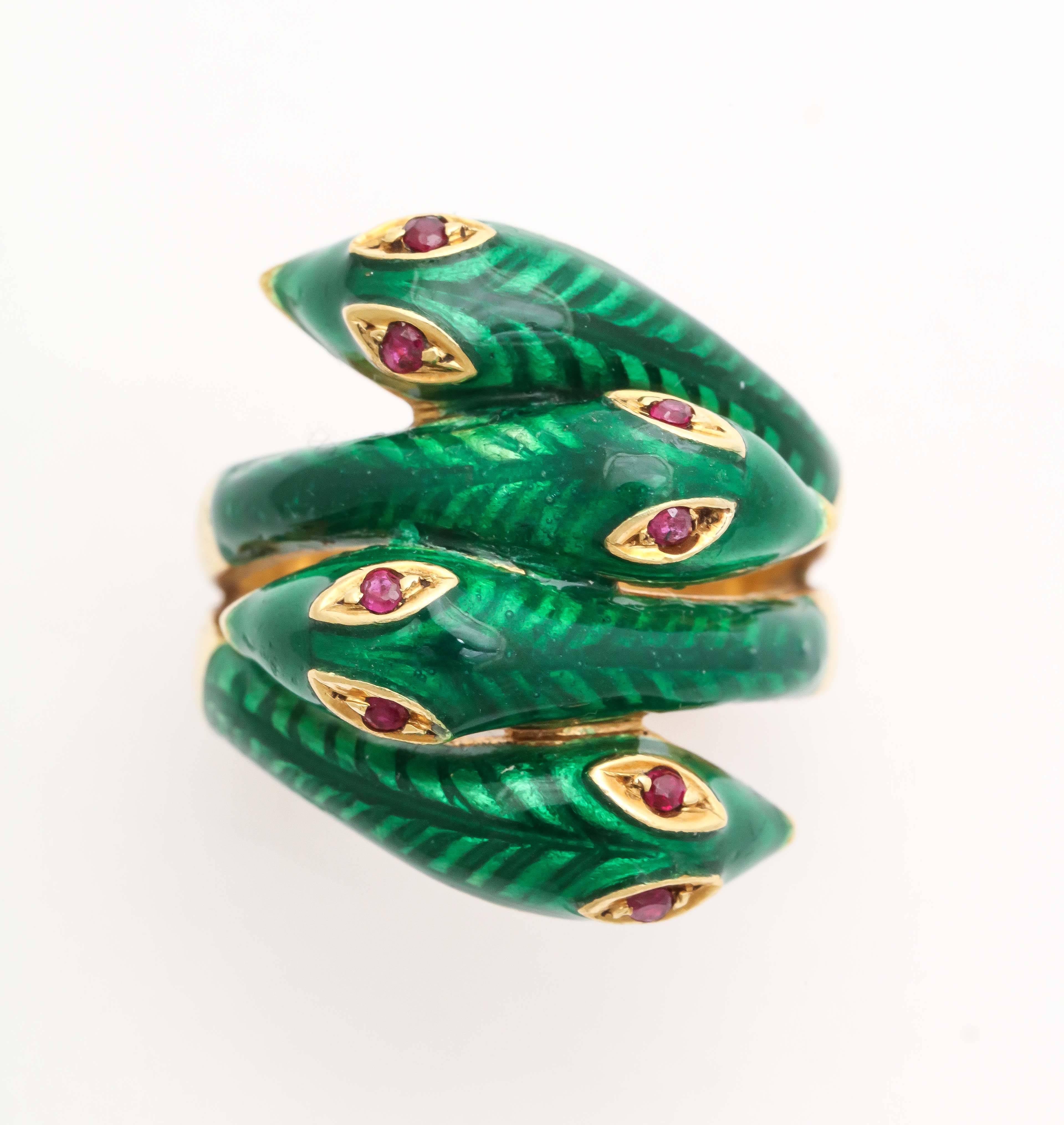 Very unusual 18kt French Green enamel snake Ring with 4 heads & Ruby eyes.  Highly unusual!  Bears French hallmarks on the outer band.  Can be sized - as enamel doesn't go all the way around - making it more versatile.  Size 4 3/4. Way to go!


