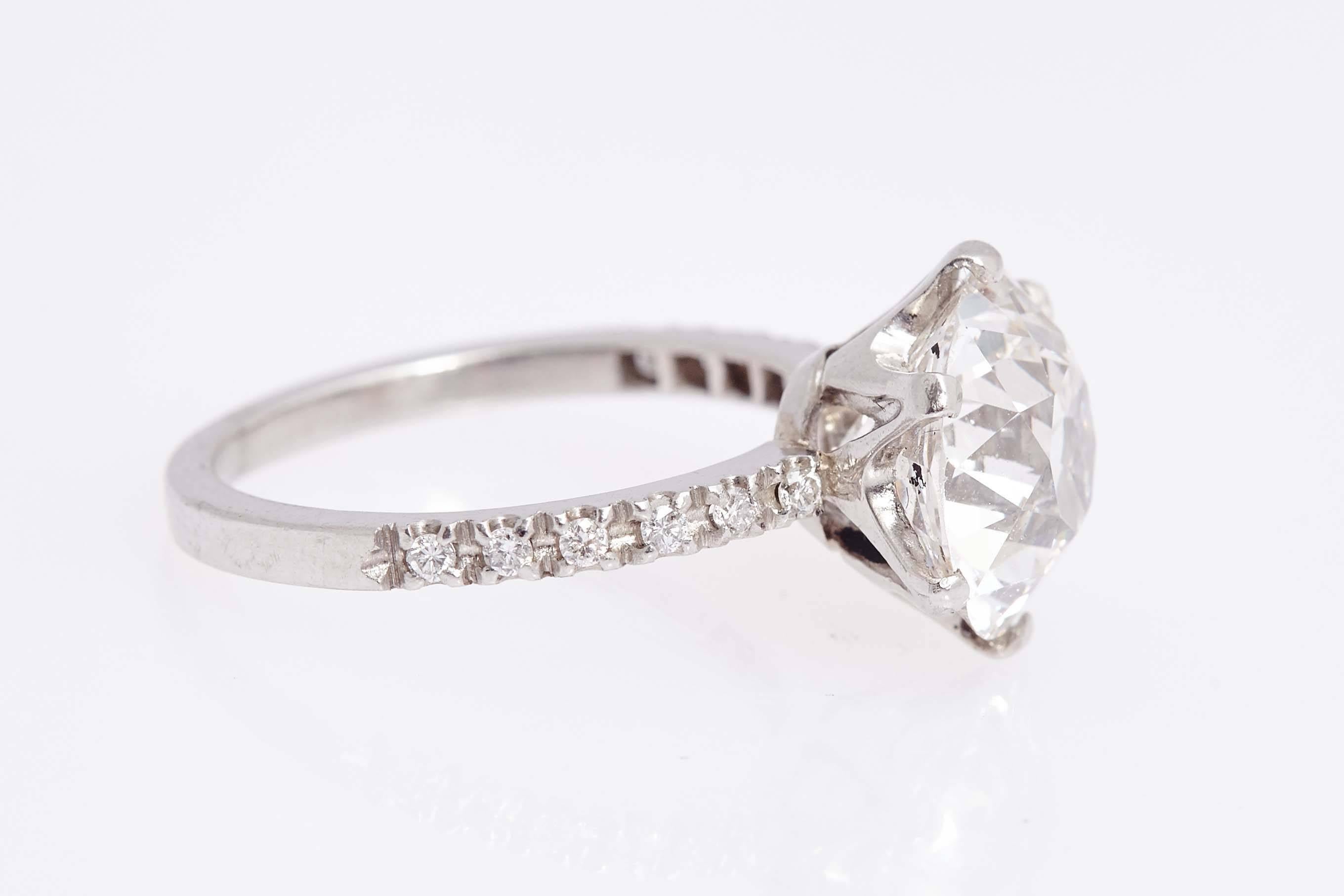 A classic 1930s engagement/solitaire ring featuring a rare type II A old-cut diamond weighing 5.59 cts, of I colour and VS1 clarity (certificate available). Smaller diamonds along half the band to enhance the fine platinum mounting. The stone is