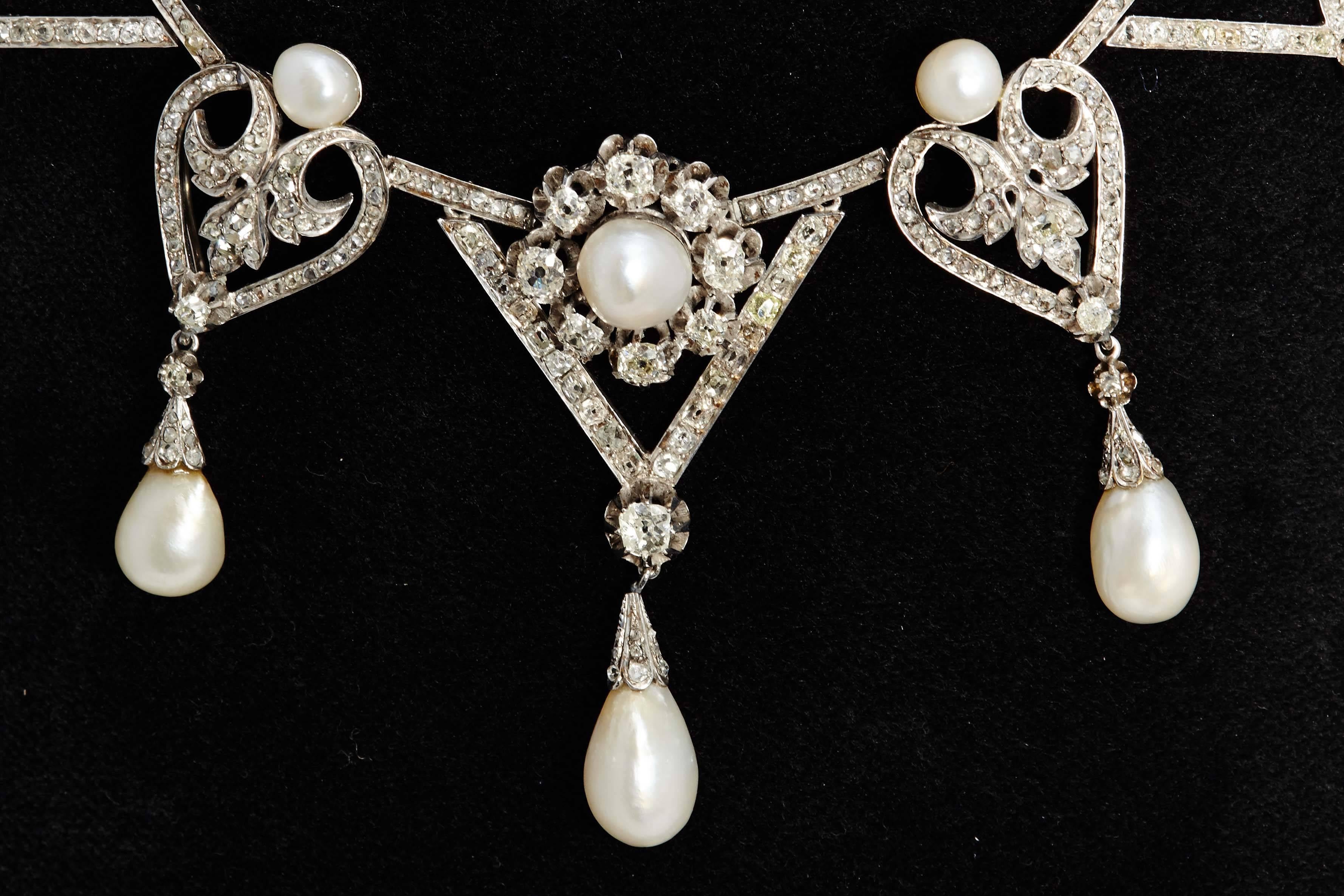 An important Bellè Epoque natural pearl and diamond necklace, mounted on  platinum, circa 1910. 