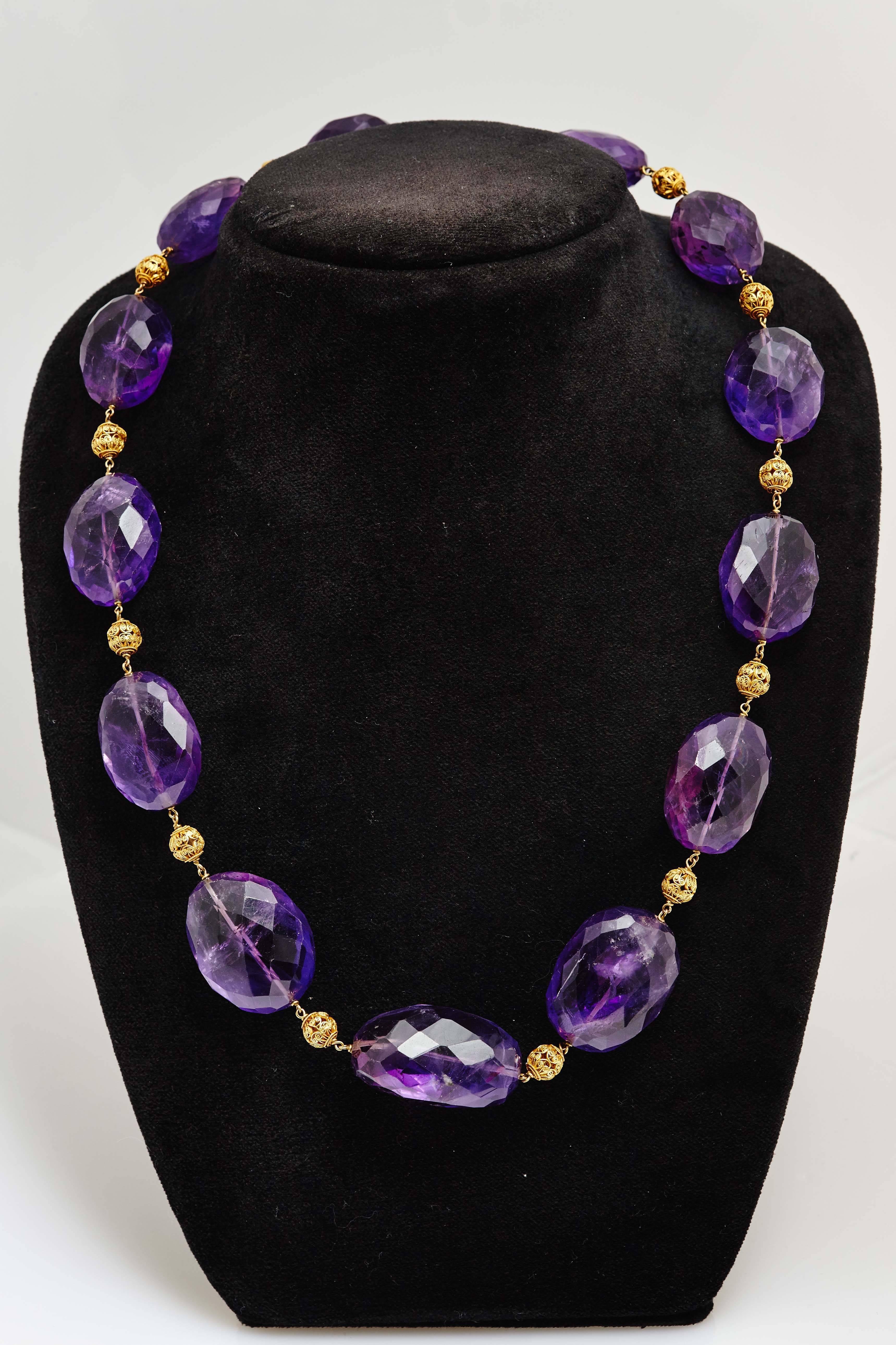 An Retro amethyst beads and gold rondelles necklace, circa 1930. 