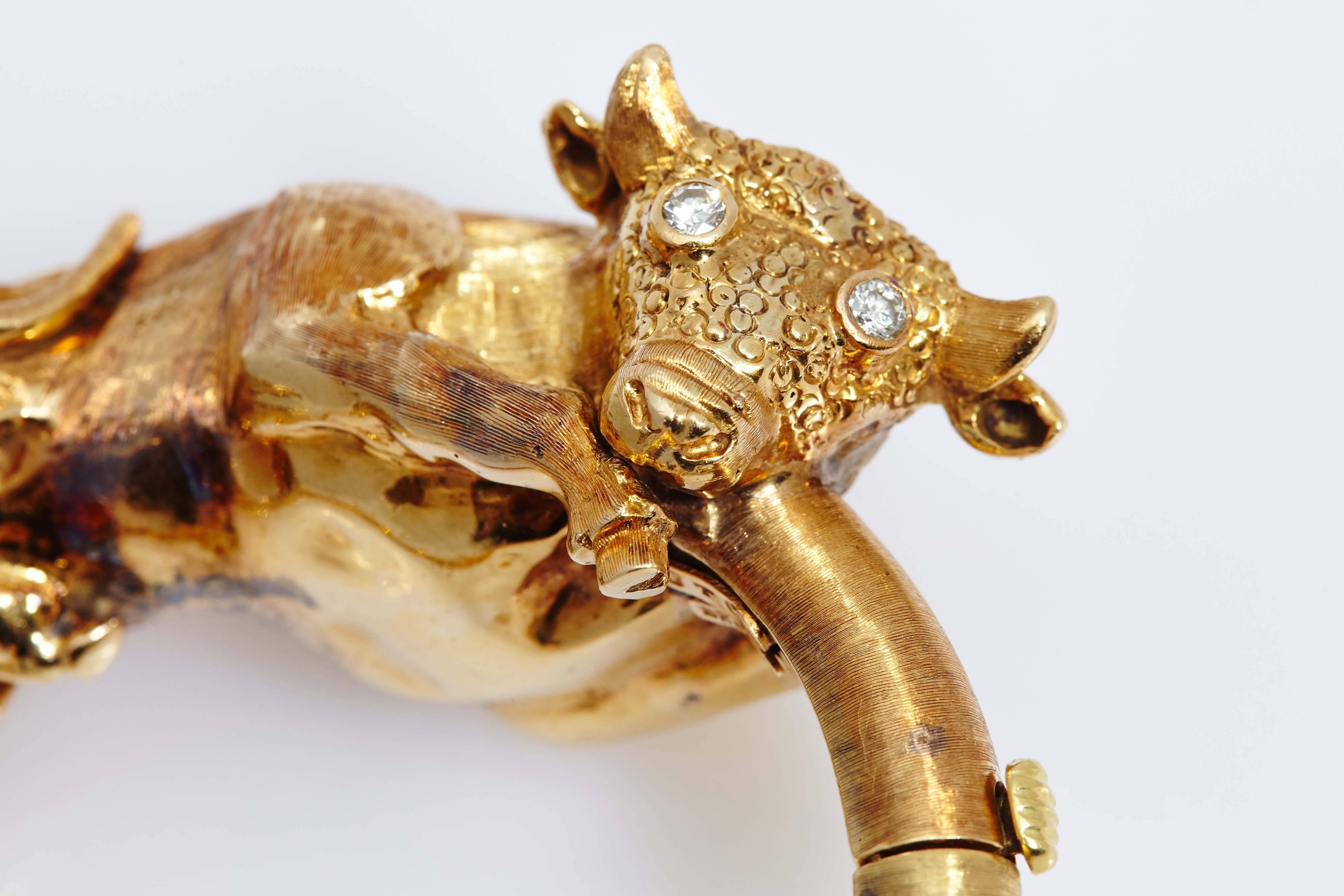 An iconic 18kt yellow gold Bull bracelet, with diamond eyes. Made in Greece, circa 1970.