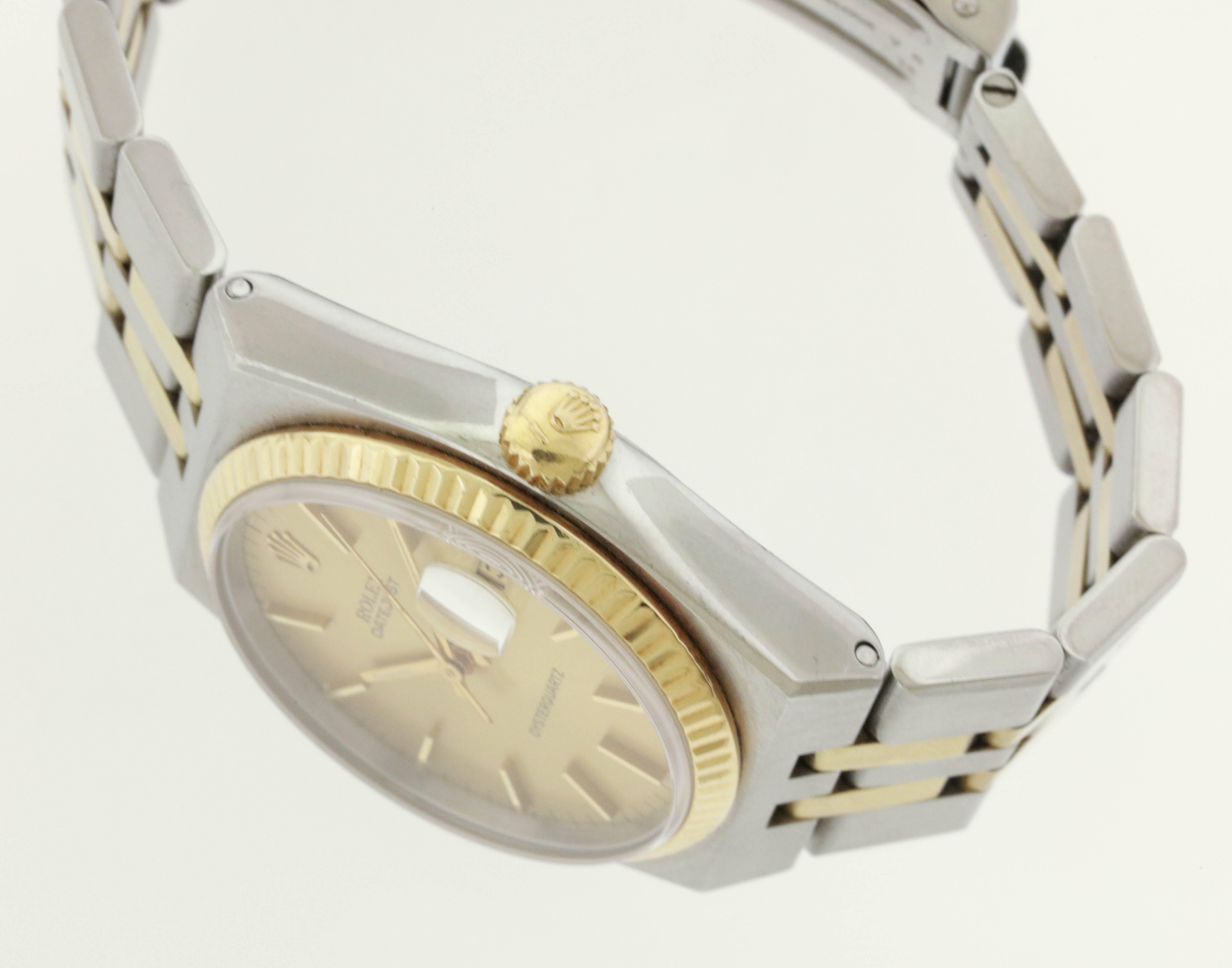 Two tone steel and 14K gold Rolex, Oysterquartz Datejust, Ref. 17013, made in 1978, is a  tonneau-shaped, center seconds, water-resistant, stainless steel and 14K yellow gold quartz wristwatch with date and an integral stainless steel and 14K yellow