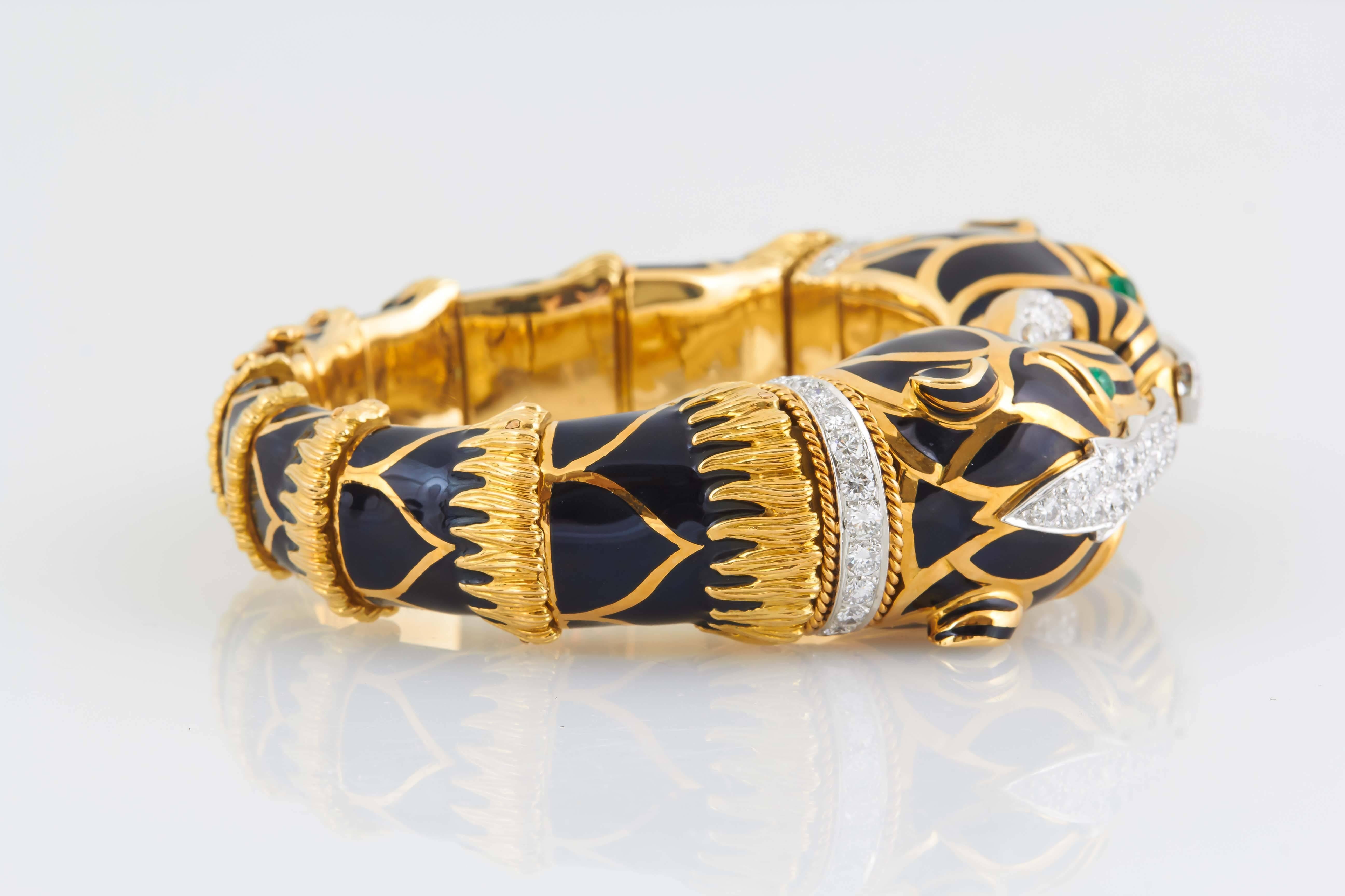 Black Tiger Bracelet finely crafted in 18k yellow gold with round brilliant cut diamonds and cabochon emeralds signed by DAVID WEBB.
Circa 1960's

