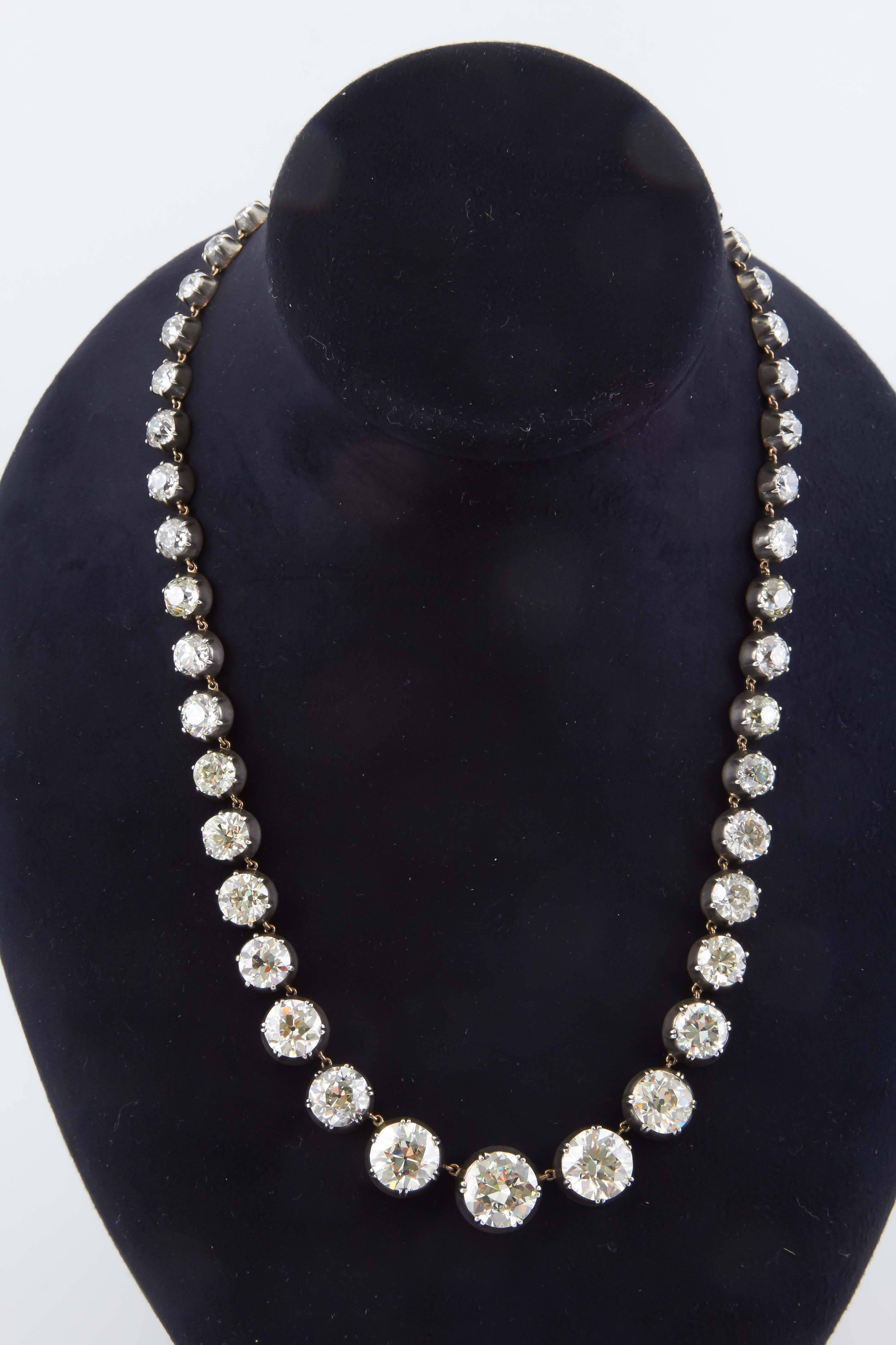 This Gorgeous Graduated Diamond Necklace is finely set in silver and 
gold. Crafted within the 21st Century using old stones. Center Diamond is approximately 5.77 cts with 45 graduating diamonds totaling approximately 77.20 cts in weight. 



