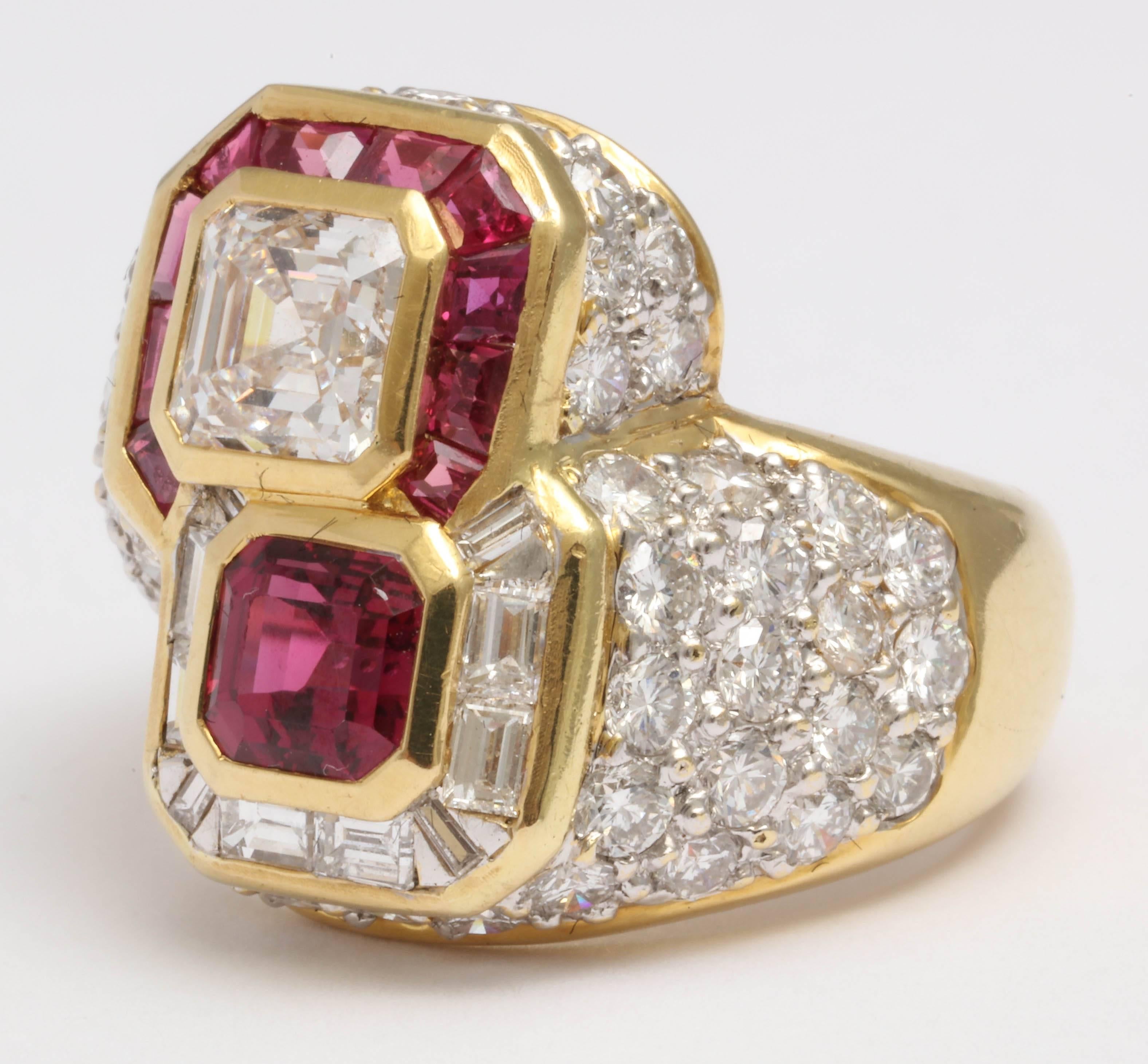 Sumptuous Asher cut Diamond - weighing approximately 1.25cts surrounded by fancy cut Rubies, opposed by an approximately 90pt cushion cut square Ruby surrounded by Diamond Baguettes.  Signed Marshall and 750. Shank is pave set wit fine, full cut,