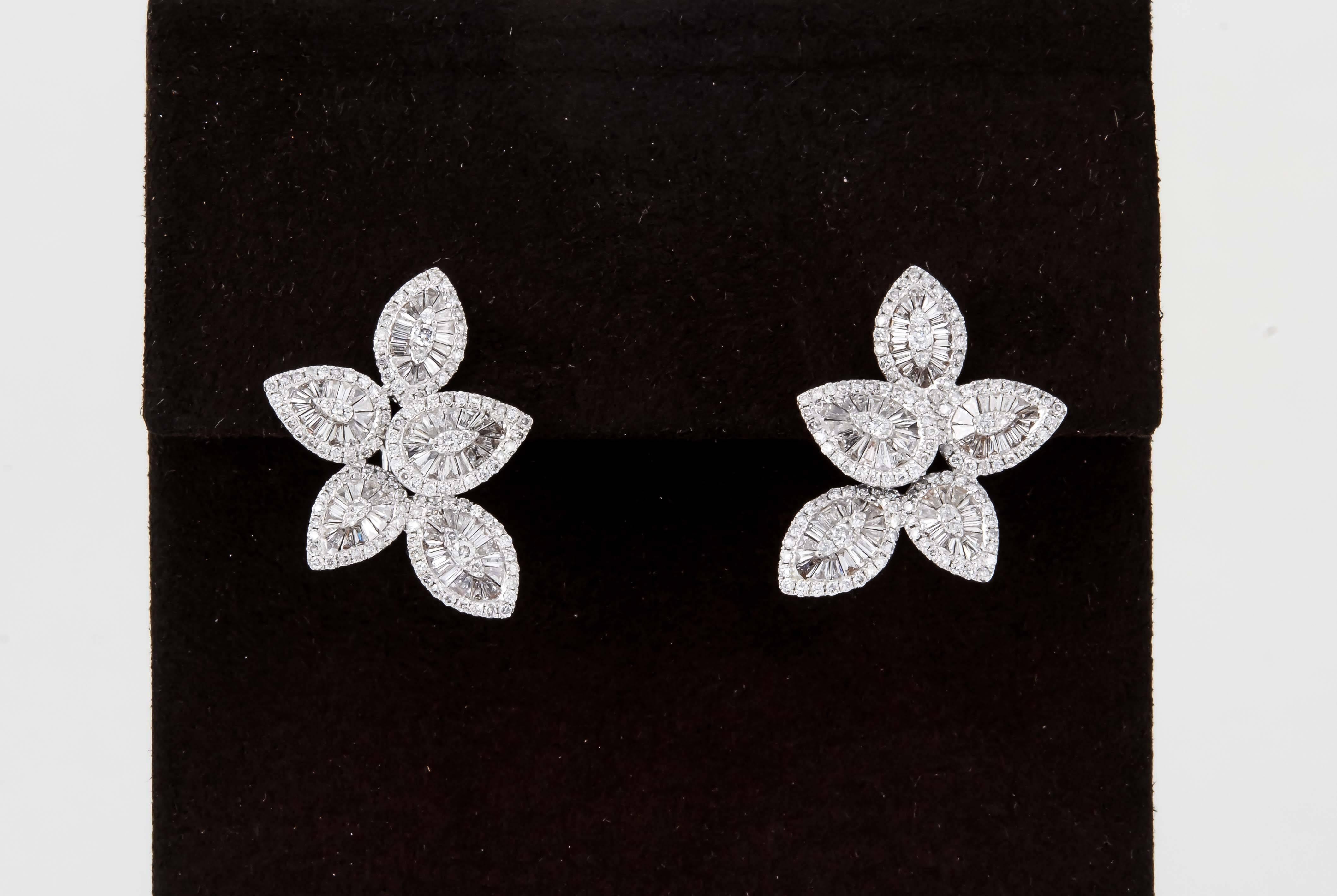 

A must have!

2.07 carats of F/G color VS clarity round and baguette cut diamonds set in an iconic pear shape and marquise design. 

A fabulous earrings that can be worn from day into evening. 

Approximately 0.72 inches at its widest