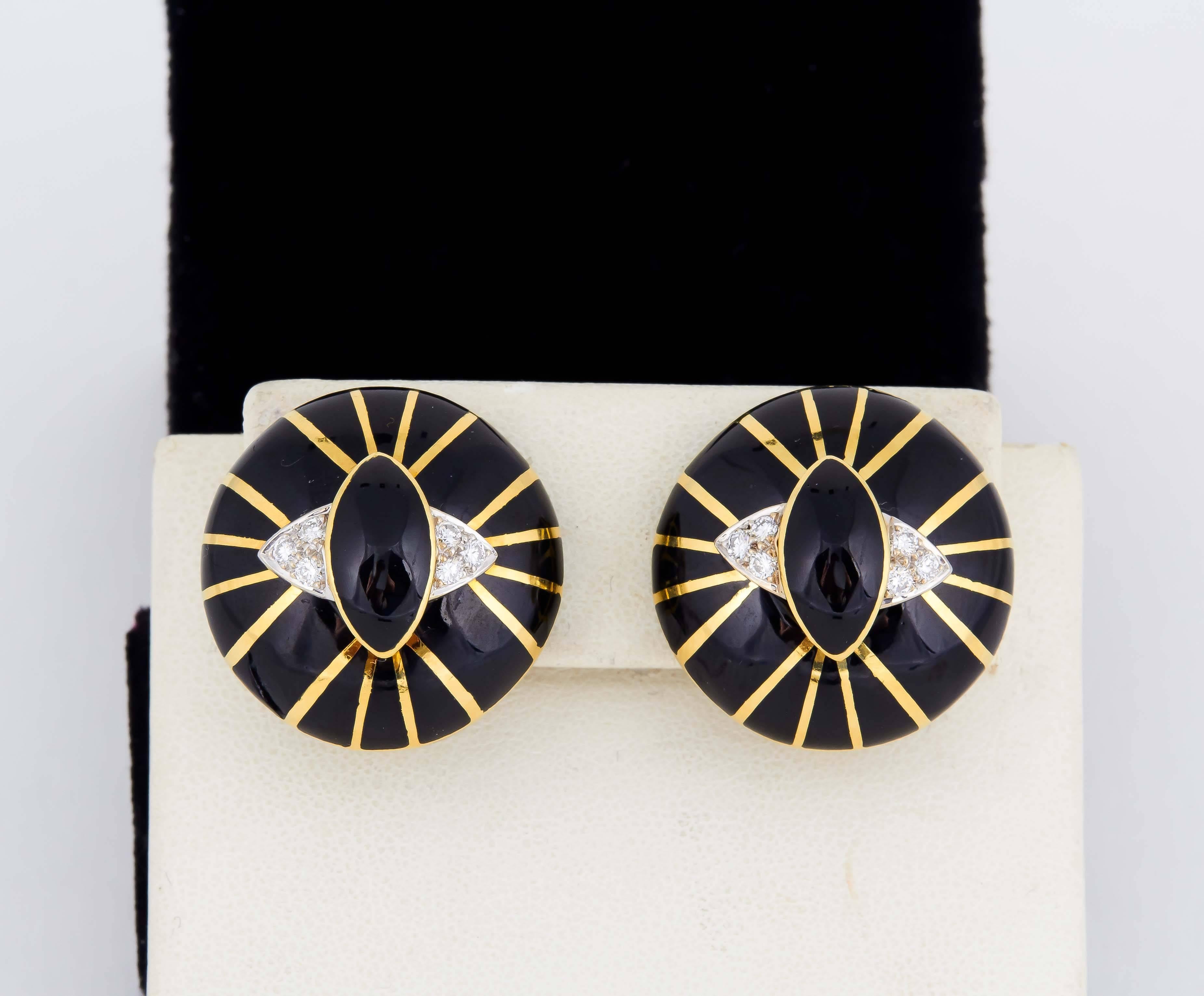 18kt Gold Solid Earclips Designed With a SpiderWeb Motif ecorated With Black Enamel And Gold Panels To Emulate A SpiderWeb Embellishment. entering 2 6mm Cabochon Marquis Cut Onyxes And Further Decorated With 12 full Cut Diamonds Weighing